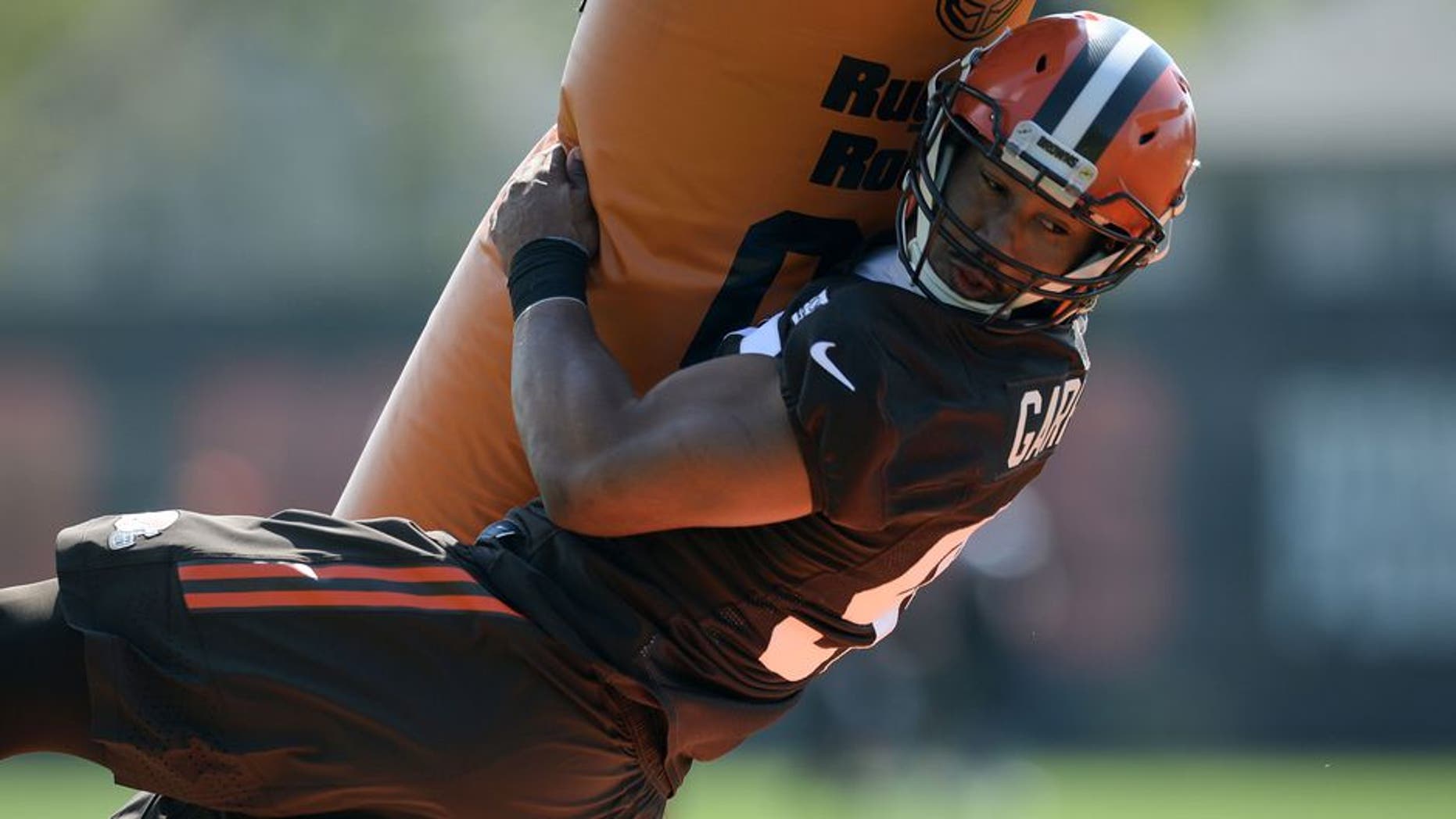 BEREA, OH - MAY 13, 2017: Defensive end Myles Garrett #95 of the Cleveland Browns takes part in a tackling drill during a rookie mini camp practice on May 13, 2017 at the Cleveland Browns training facility in Berea, Ohio. 17-05136945 2017 Nick Cammett/Diamond Images/Getty Images