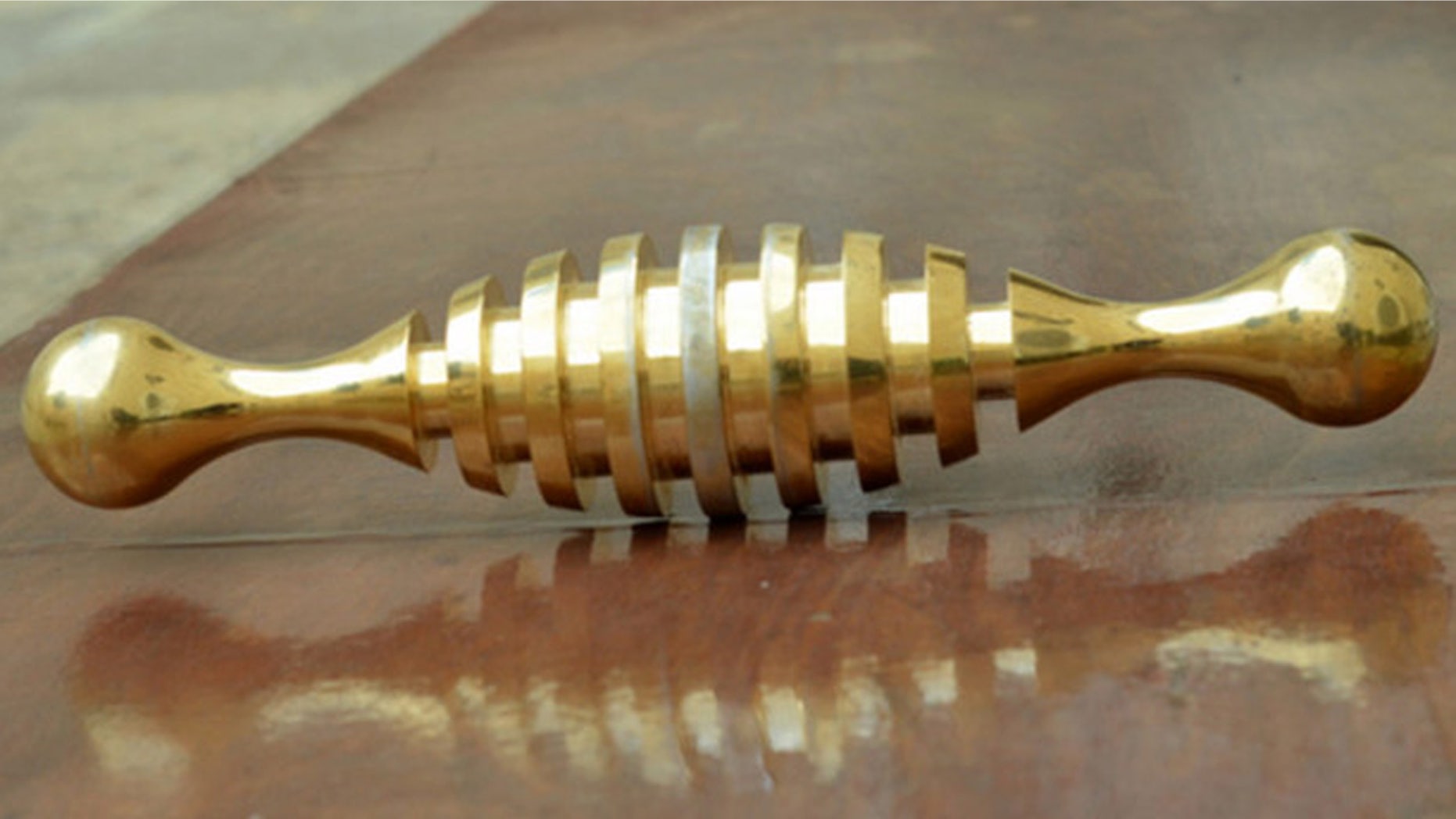 This undated photo by the Israel Antiquities Authority shows an object discovered in a Jerusalem cemetery six months ago that was identified by a Facebook user as a modern New Age device after experts had been stumped for six months (Israel Antiquities Authority)