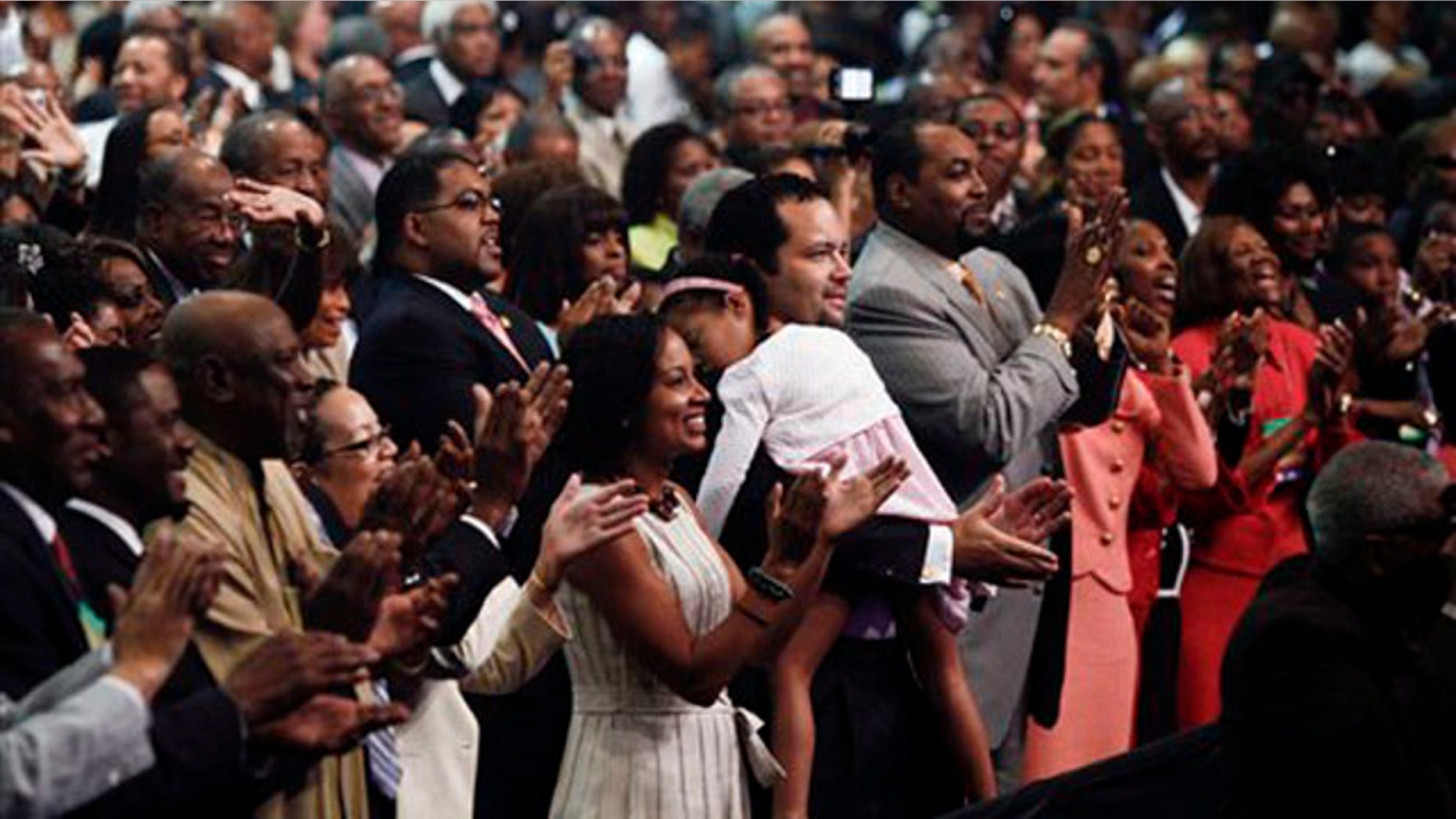 The audience applauds after first lady Michelle Obama speaks at the annual NAACP convention July 12 in Kansas City, Mo. (AP Photo)