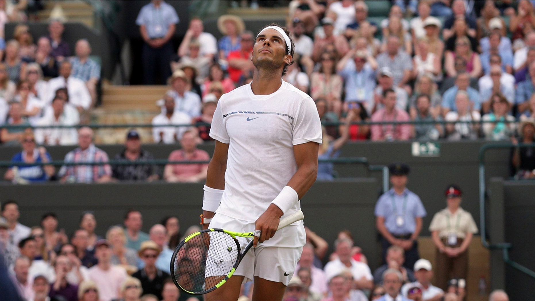 Rafael Nadal looks up during his Round of 16 match against Gilles Muller at Wimbledon Monday