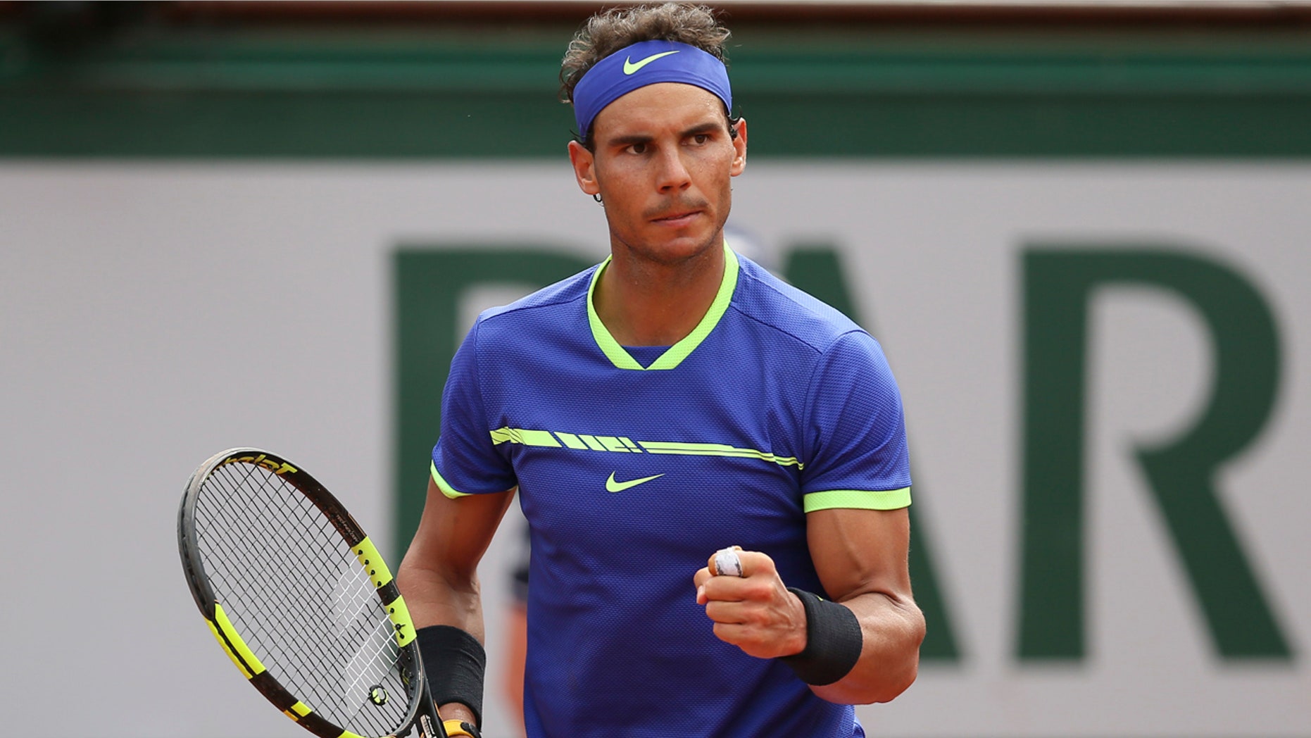 Spain's Rafael Nadal clenches his fist as he plays Switzerland's Stan Wawrinka during their final match of the French Open tennis tournament at the Roland Garros stadium, Sunday, June 11, 2017 in Paris.