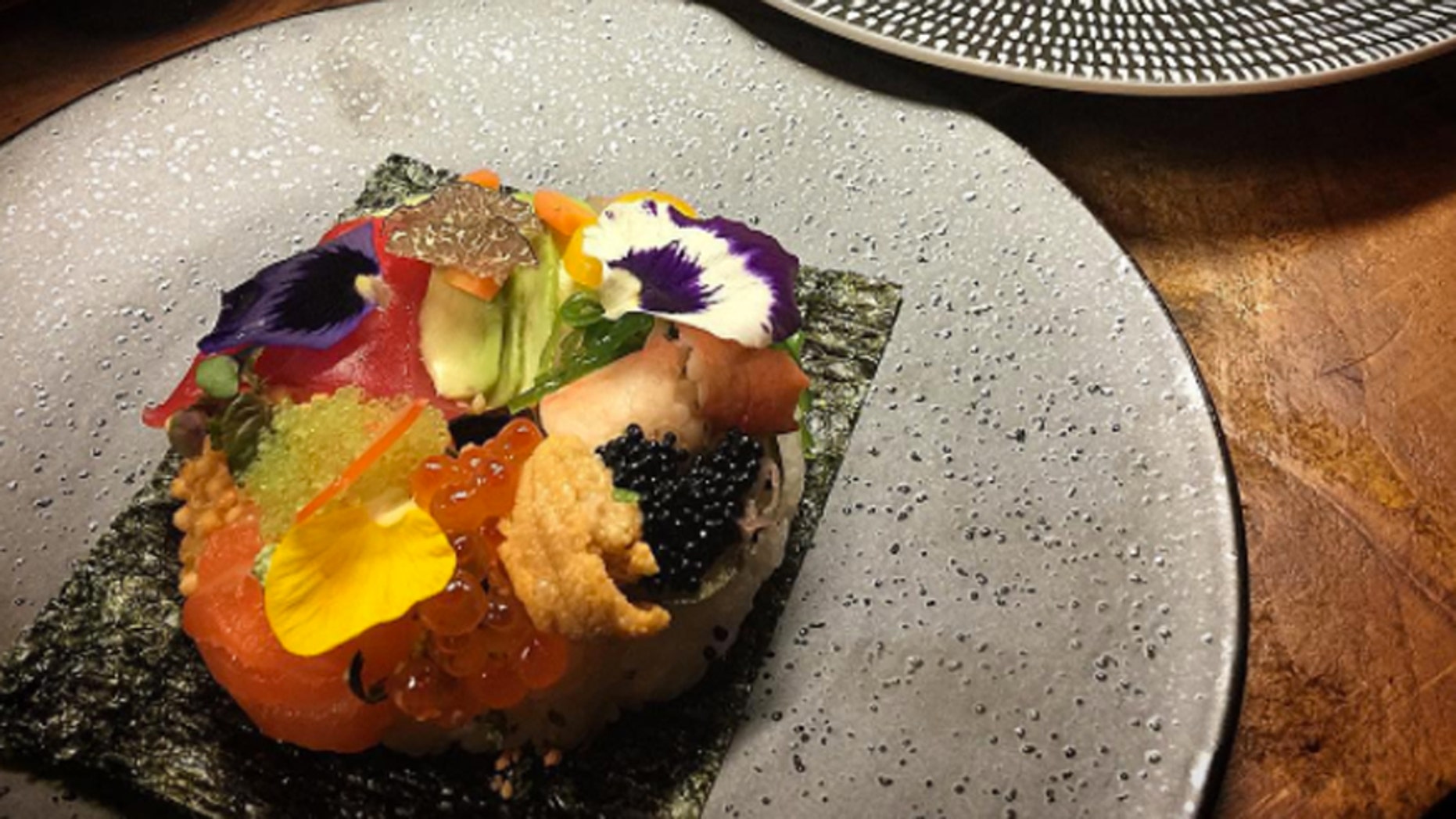 The sushi doughnut is a ring-shaped dish of fish, vegetables and more.