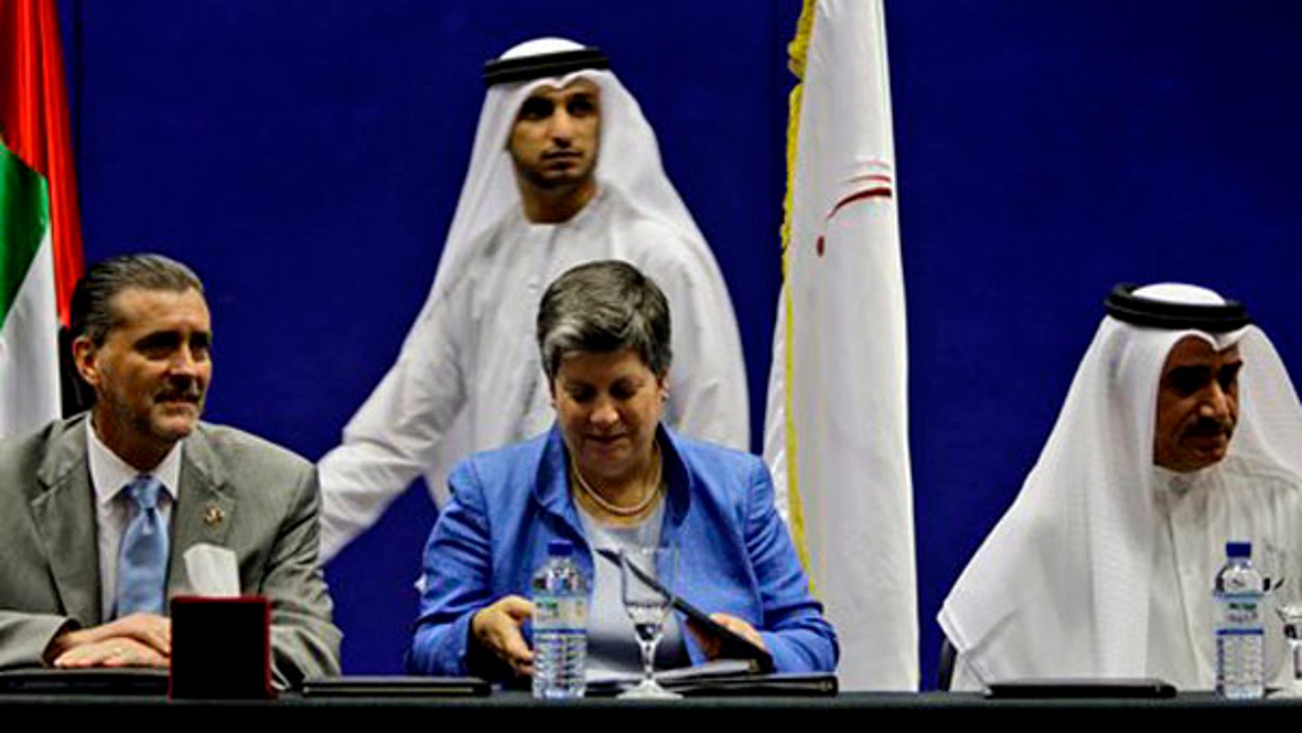 Secretary of Homeland Security Janet Napolitano, center, prepares her papers before giving a speech at a conference at the Zayed University in Abu Dhabi, United Arab Emirates, Nov. 8. (AP Photo)