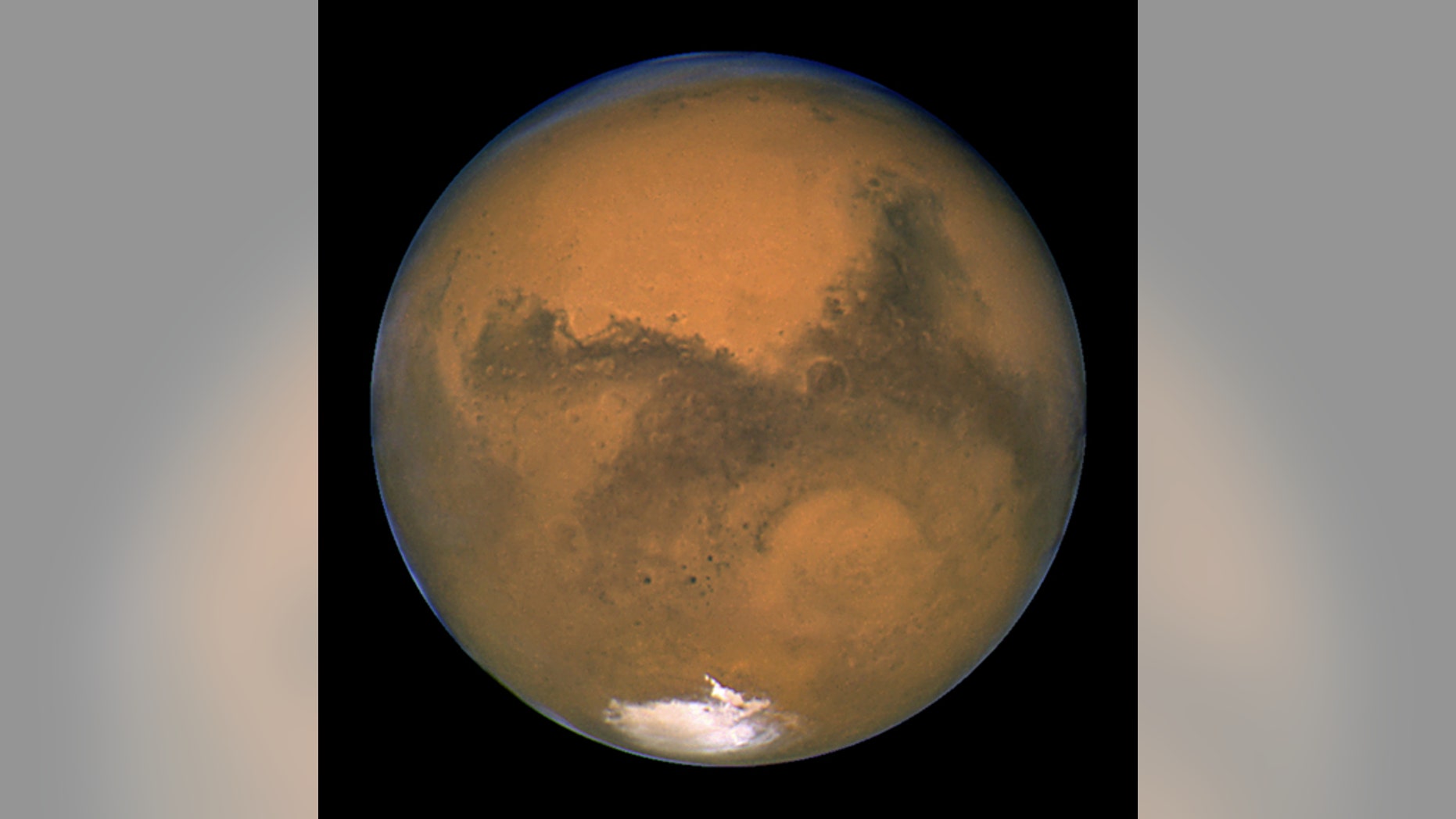 NASA's Hubble Space Telescope snapped this shot of Mars on Aug. 26, 2003, when the Red Planet was 34.7 million miles from Earth. The picture was taken just 11 hours before Mars made its closest approach to us in 60,000 years.