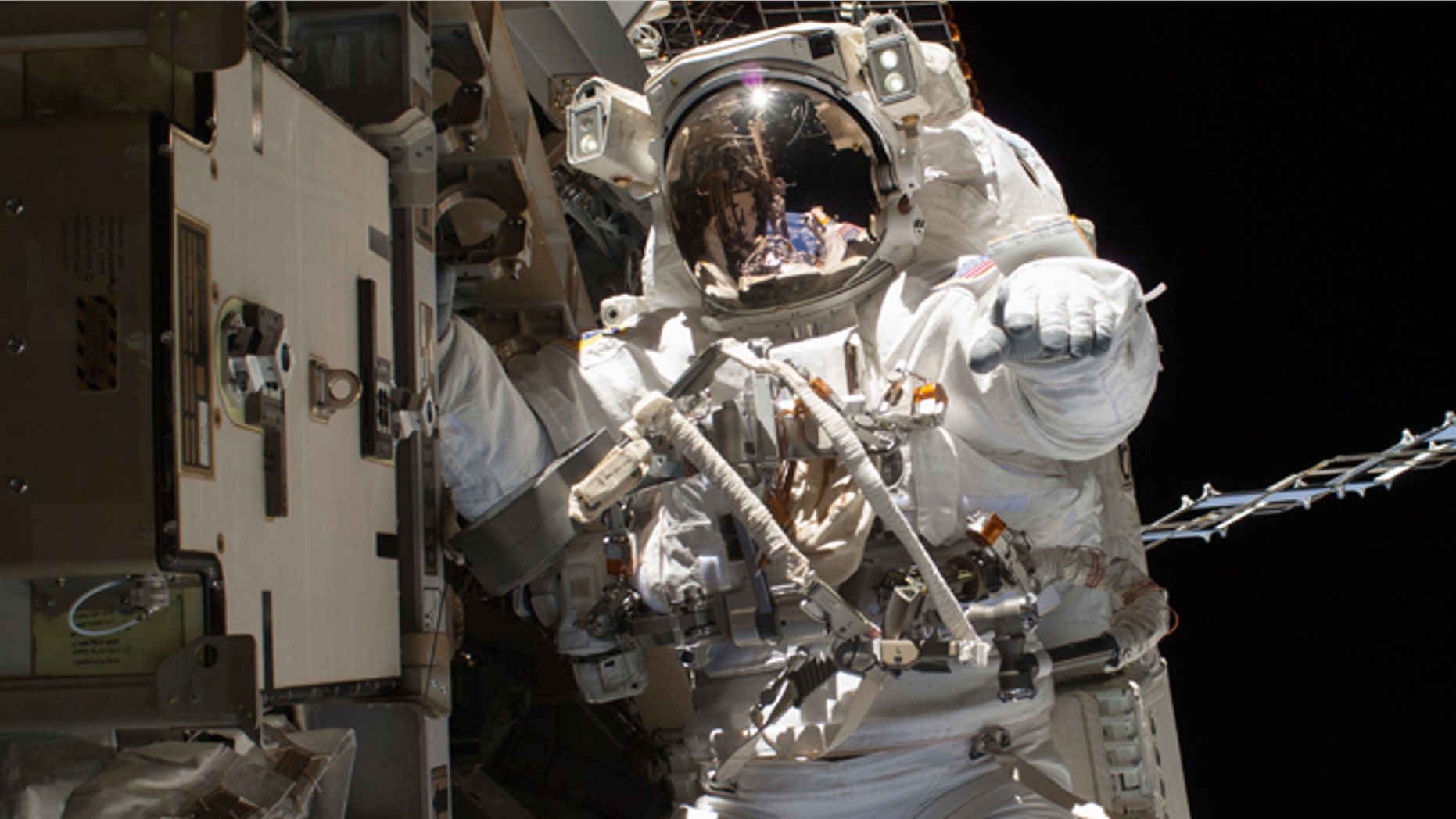 April 22, 2014: In this photo provided by NASA, astronaut Steve Swanson is pictured during a spacewalk to replace a failed backup computer relay box on the International Space Station.