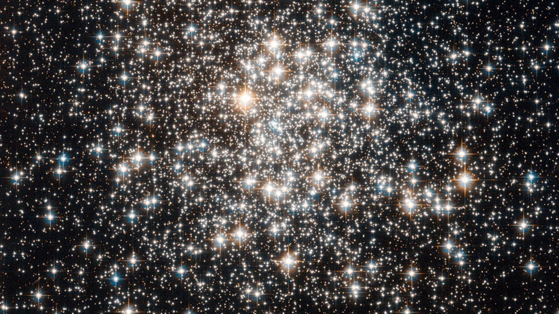File photo - the Hubble Space Telescope has captured a crowd of stars that looks rather like a stadium darkened before a show, lit only by the flashbulbs of the audiences cameras. (NASA)