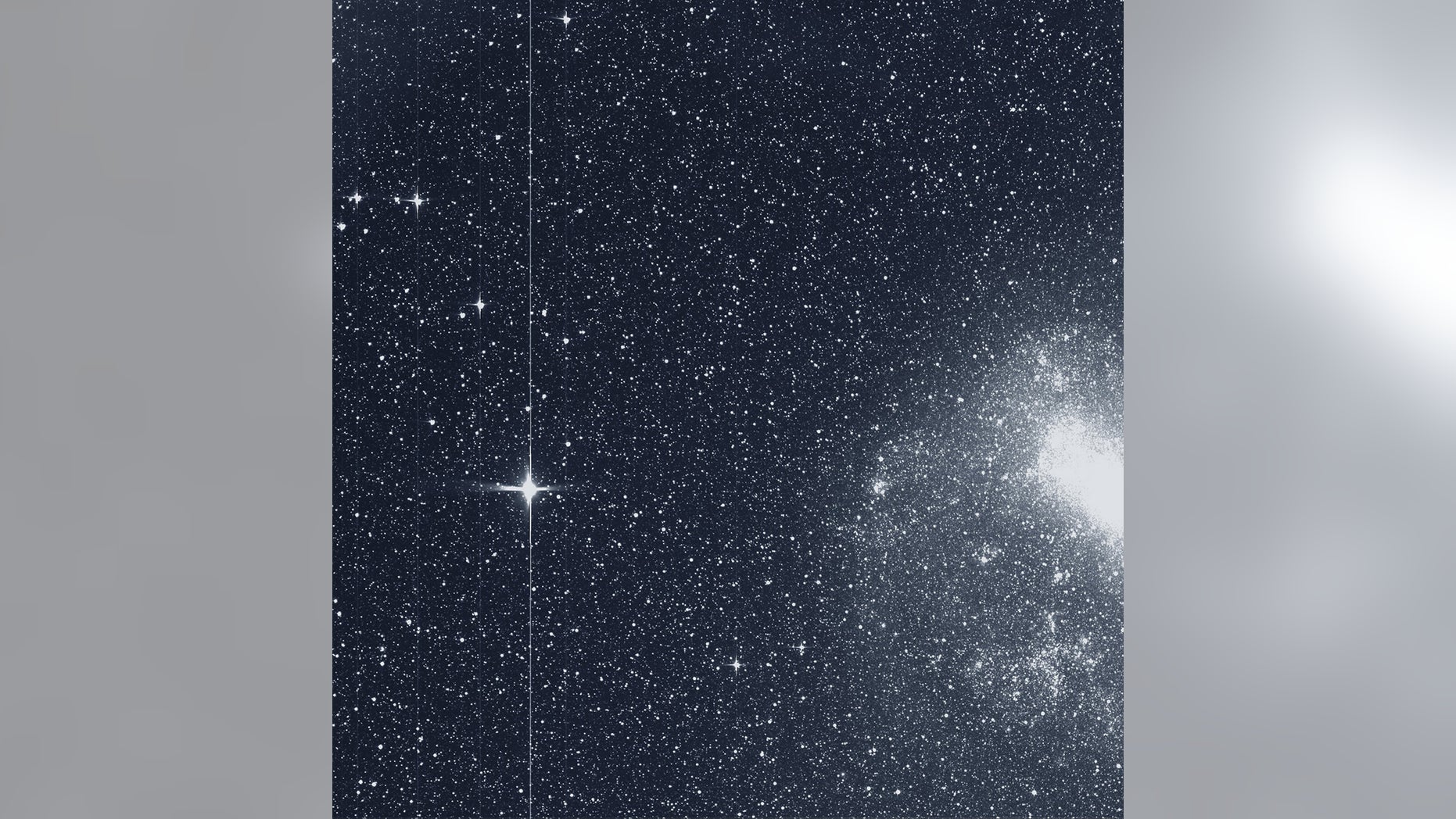 The Transiting Exoplanet Survey Satellite (TESS) took this snapshot of the Large Magellanic Cloud (right) and the bright star R Doradus (left) with just a single detector of one of its cameras on Tuesday, Aug. 7. The frame is part of a swath of the southern sky TESS captured in its “first light” science image as part of its initial round of data collection. (Credit: NASA/MIT/TESS)