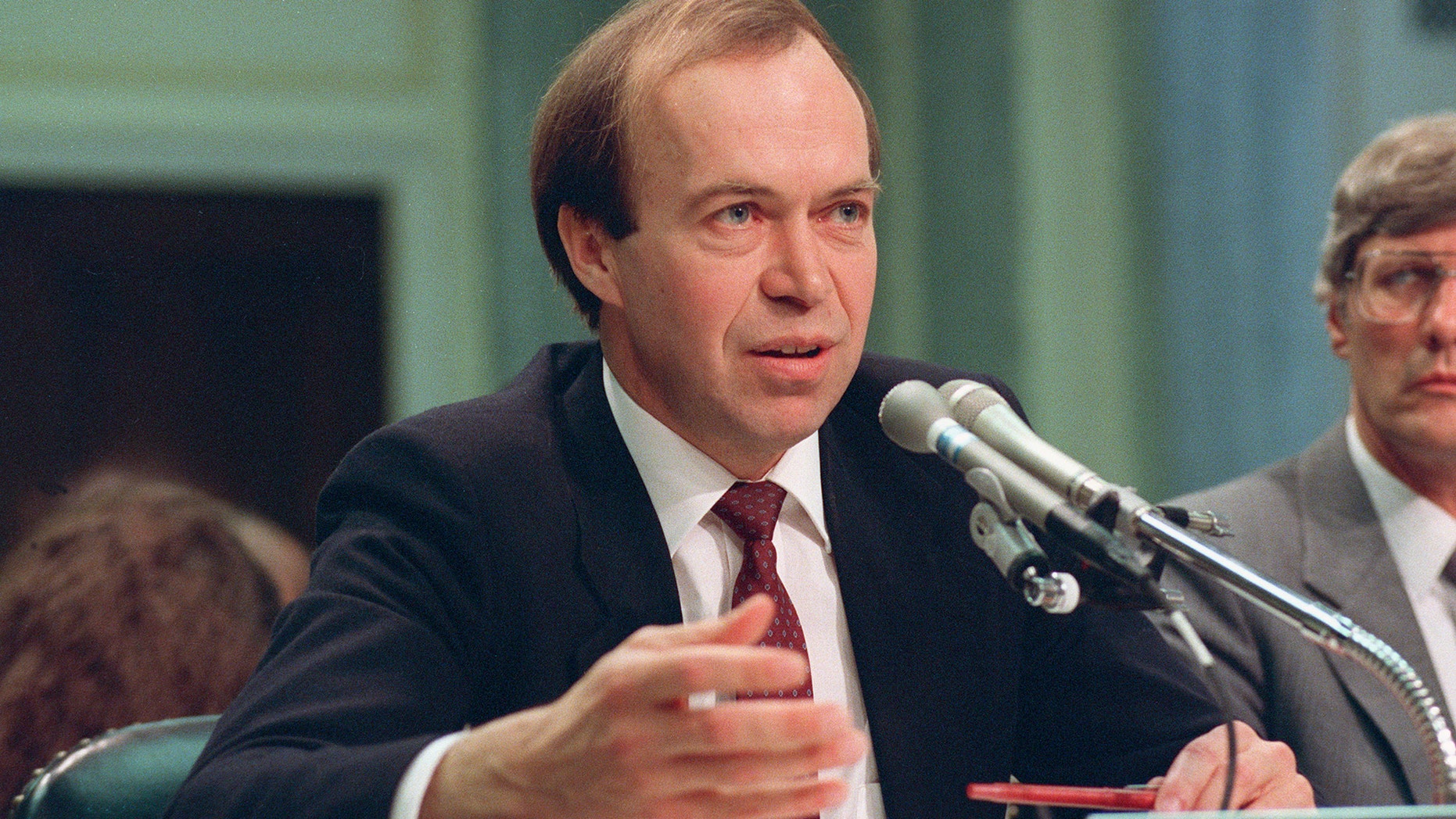 FILE - In this May 9, 1989 file photo, Dr. James Hansen, director of NASA's Goddard Institute for Space Studies in New York, testifies before a Senate Transportation subcommittee on Capitol Hill in Washington, D.C., a year after his history-making testimony telling the world that global warming was here and would get worse. (AP Photo/Dennis Cook, File)