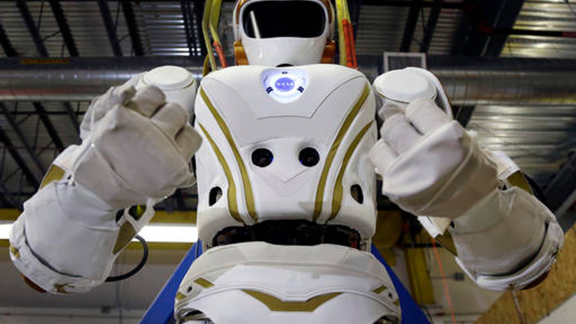 A 6-foot, 300-pound Valkyrie robot is seen at University of Massachusetts-Lowell's robotics center in Lowell, Mass. (AP Photo/Elise Amendola)