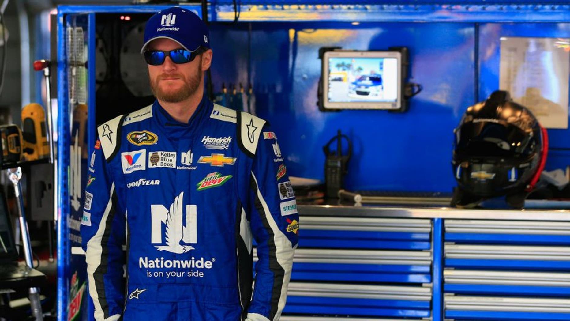 LOUDON, NH - SEPTEMBER 26: Dale Earnhardt Jr., driver of the #88 Nationwide Chevrolet, stands in the garage area during practice for the NASCAR Sprint Cup Series Sylvania 300 at New Hampshire Motor Speedway on September 26, 2015 in Loudon, New Hampshire. (Photo by Chris Trotman/Getty Images)