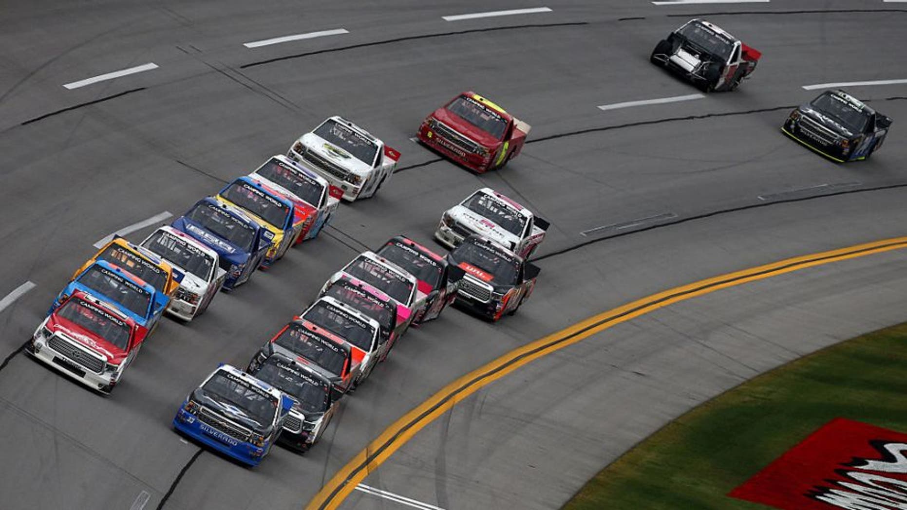 TALLADEGA, AL - OCTOBER 24: Timothy Peters, driver of the #17 Red Horse Racing Toyota, and Brandon Jones, driver of the #33 Wittichen Supply Company Chevrolet, lead the field to a restart during the NASCAR Camping World Truck Series fred's 250 at Talladega Superspeedway on October 24, 2015 in Talladega, Alabama. (Photo by Tom Pennington/Getty Images)