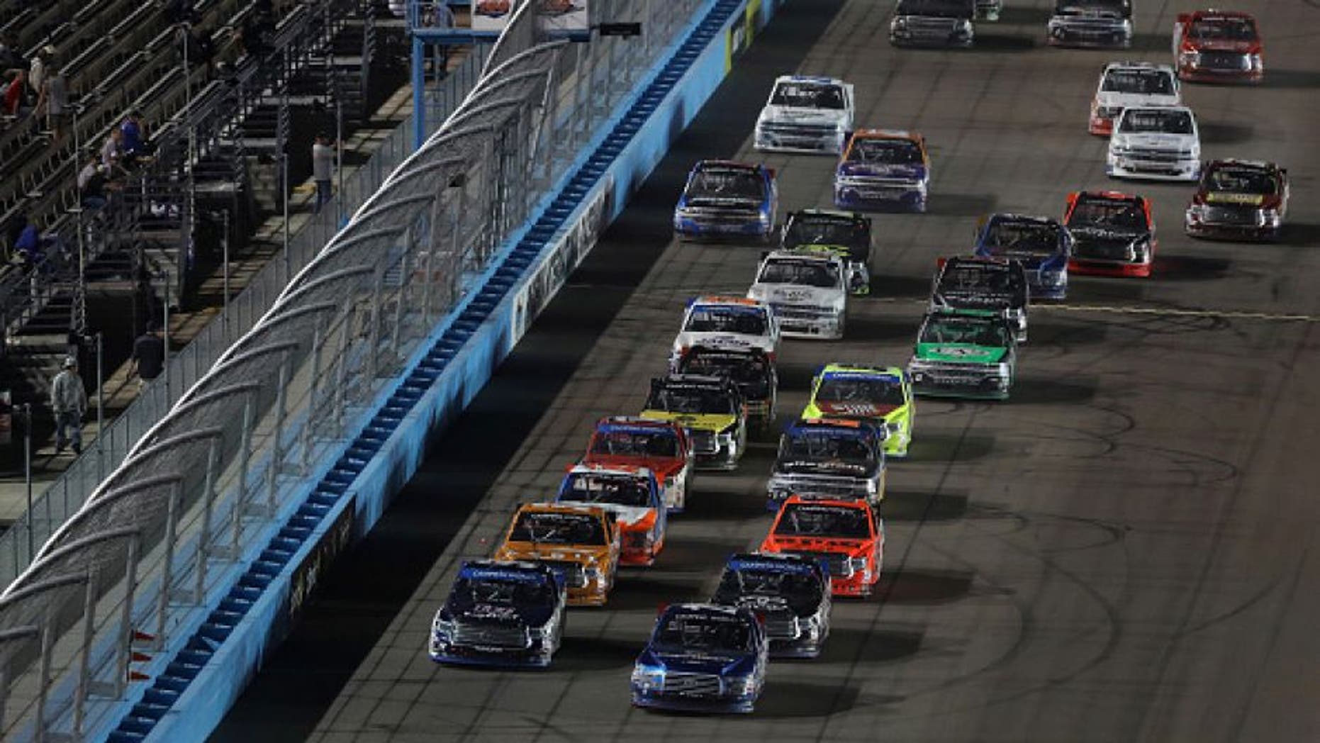 AVONDALE, AZ - NOVEMBER 11: Tyler Reddick, driver of the #29 Cooper Standard Ford, and William Byron, driver of the #9 Liberty University Toyota, lead the field in a restart during the NASCAR Camping World Truck Series Lucas Oil 150 at Phoenix International Raceway on November 11, 2016 in Avondale, Arizona. (Photo by Christian Petersen/Getty Images)