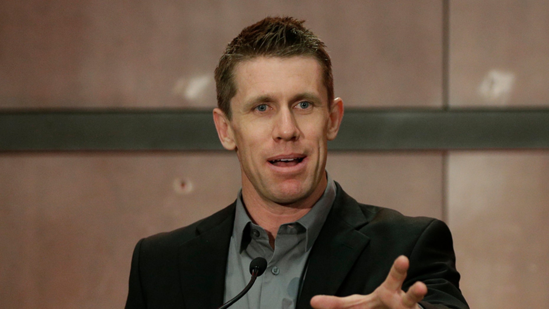 Carl Edwards speaks to the media during a news conference at Joe Gibbs Racing in Huntersville, N.C., Wednesday, Jan. 11, 2017. Edwards announced he was stepping away from racing. (AP Photo/Chuck Burton)