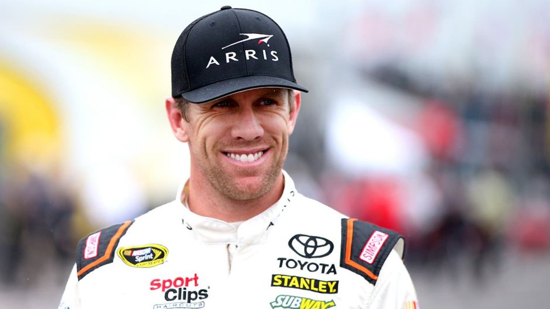 LONG POND, PA - JUNE 03: Carl Edwards, driver of the #19 ARRIS Toyota, stands in the garage area during practice for the NASCAR Sprint Cup Series Axalta "We Paint Winners" 400 at Pocono Raceway on June 3, 2016 in Long Pond, Pennsylvania. (Photo by Sean Gardner/Getty Images)