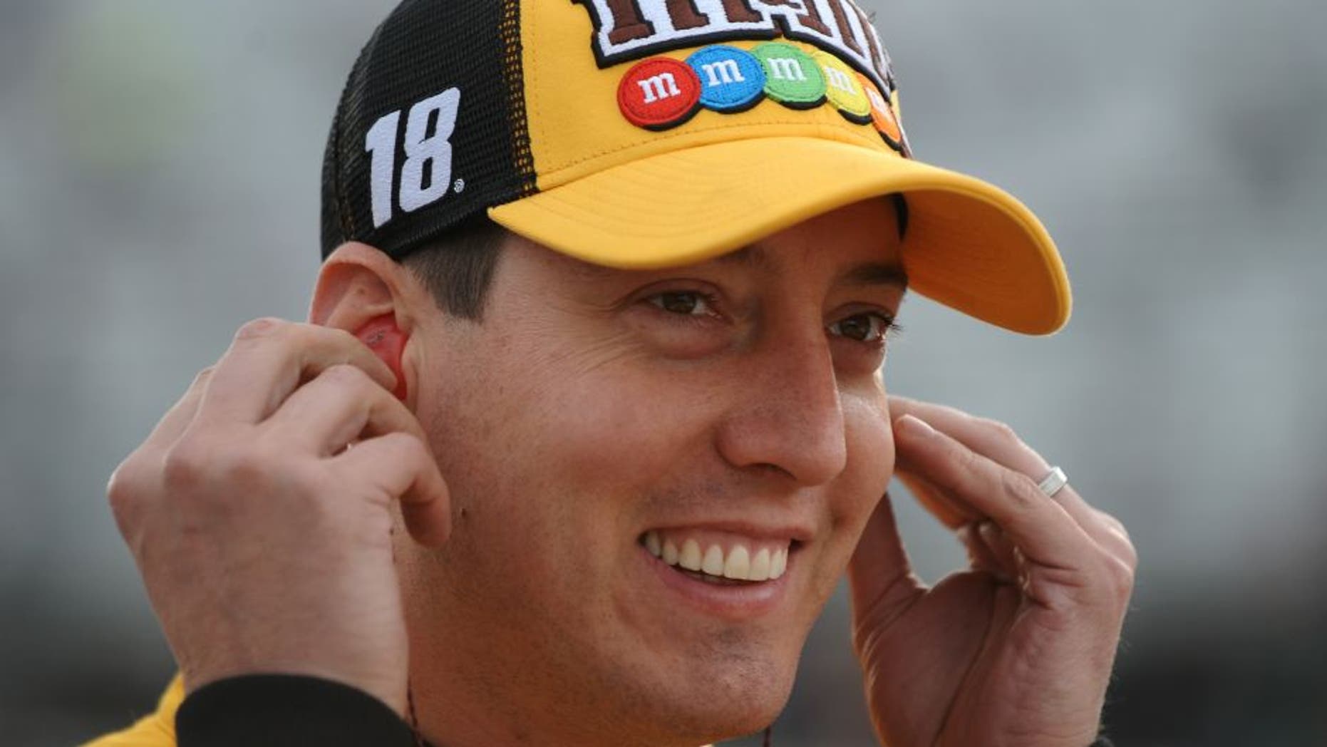LOUDON, NH - SEPTEMBER 23: Kyle Busch, driver of the #18 M&M's Core Toyota, stands on the grid during qualifying for the NASCAR Sprint Cup Series Bad Boy Off Road 300 at New Hampshire Motor Speedway on September 23, 2016 in Loudon, New Hampshire. (Photo by Rainier Ehrhardt/NASCAR via Getty Images)