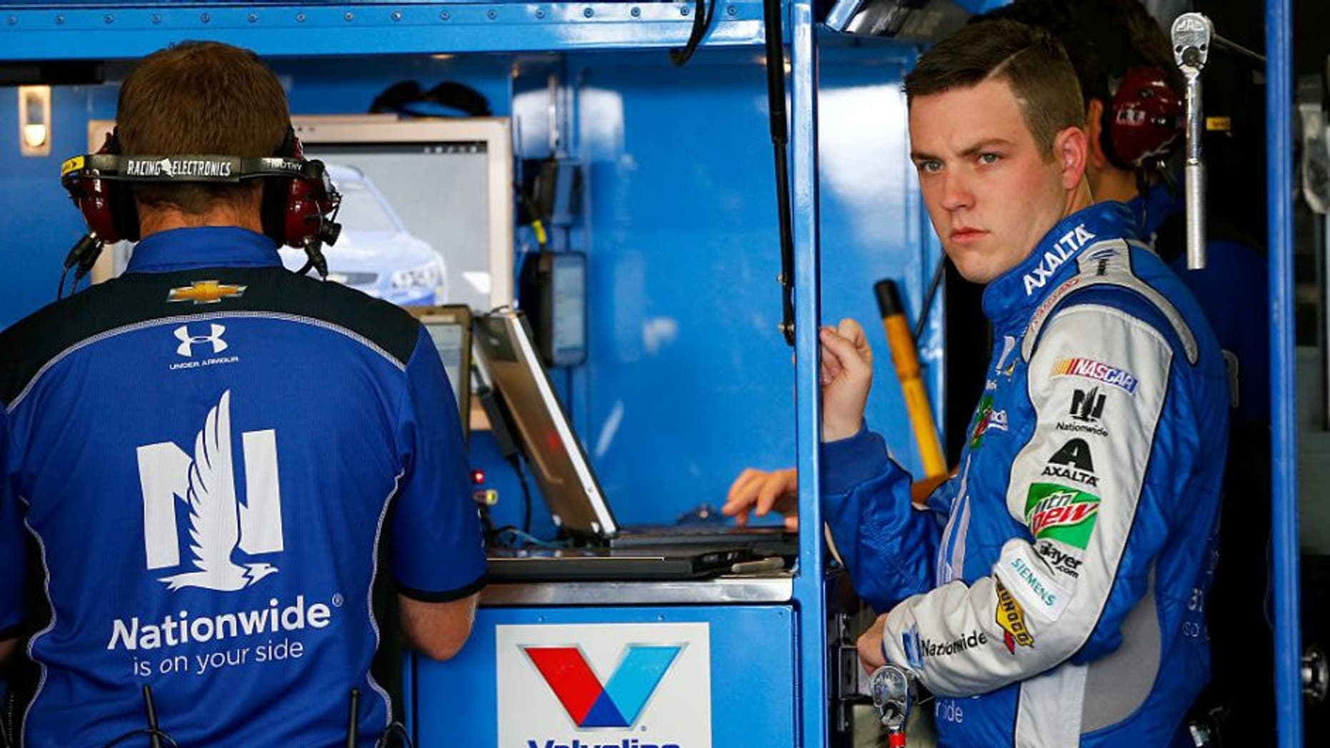 LOUDON, NH - SEPTEMBER 23: Alex Bowman, driver of the #88 Nationwide Chevrolet, stands in the garage area during practice for the NASCAR Sprint Cup Series Bad Boy Off Road 300 at New Hampshire Motor Speedway on September 23, 2016 in Loudon, New Hampshire. (Photo by Jonathan Ferrey/Getty Images)