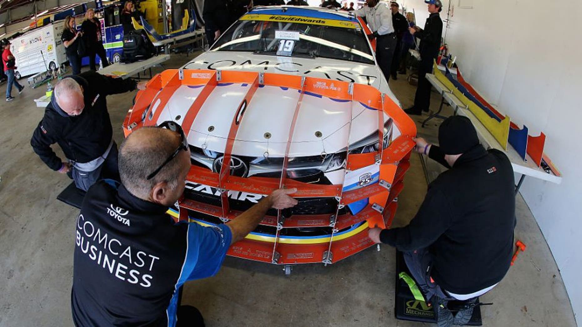 LOUDON, NH - SEPTEMBER 25: The car of Carl Edwards, driver of the #19 Comcast Business Toyota, goes through pre-race inspection prior to the NASCAR Sprint Cup Series Bad Boy Off Road 300 at New Hampshire Motor Speedway on September 25, 2016 in Loudon, New Hampshire. (Photo by Jerry Markland/Getty Images)
