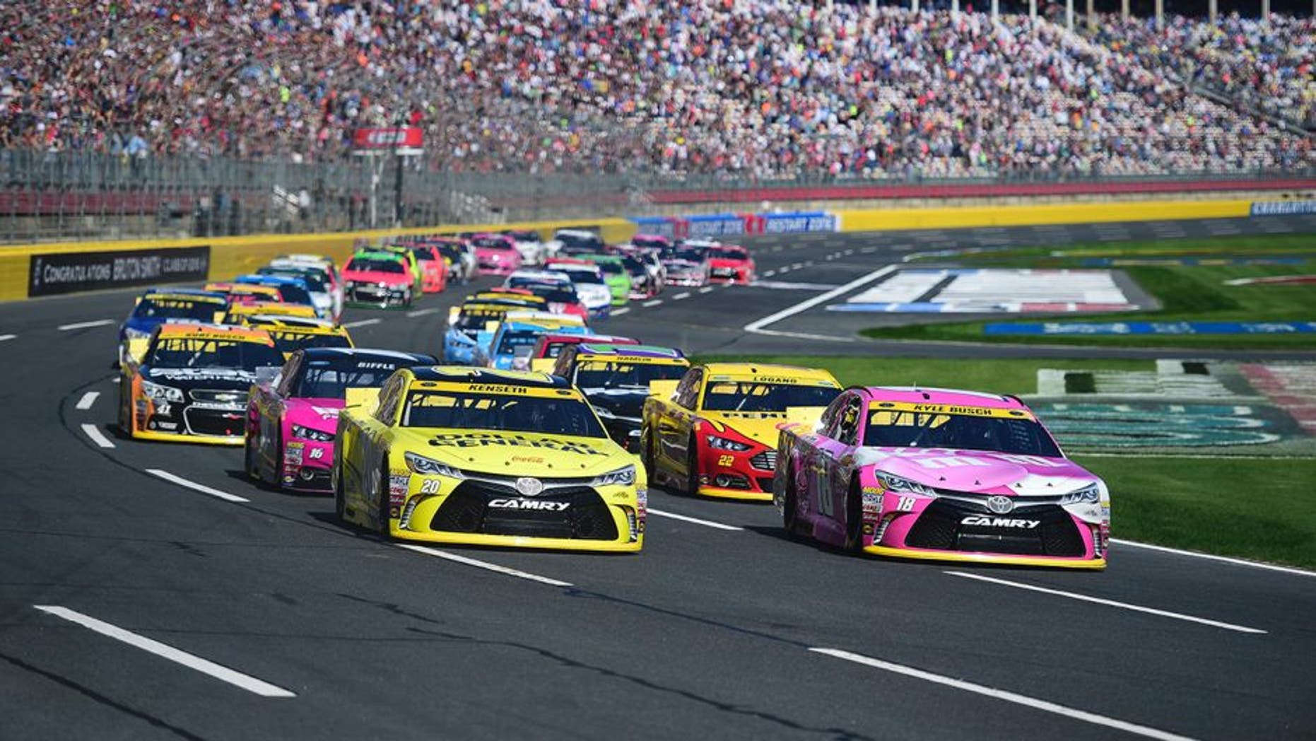 Drivers race during the NASCAR Sprint Cup Series Bank of America 500 at Charlotte Motor Speedway on October 11, 2015 in Charlotte, North Carolina.