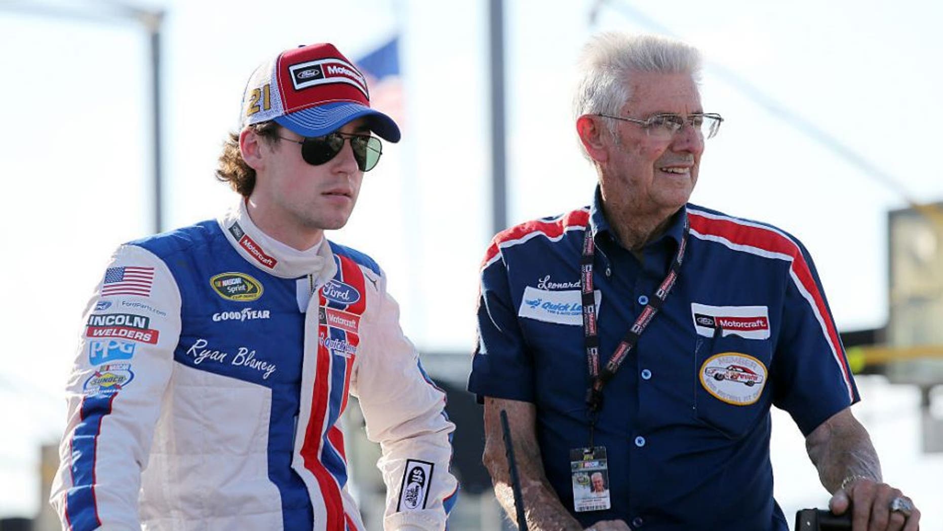DARLINGTON, SC - SEPTEMBER 04: Ryan Blaney, driver of the #21 Motorcraft/Quick Lane Tire & Auto Center Ford, rides with NASCAR Hall of Famer Leonard Wood during pre-race festivities for the NASCAR Sprint Cup Series Bojangles' Southern 500 at Darlington Raceway on September 4, 2016 in Darlington, South Carolina. (Photo by Jerry Markland/Getty Images)