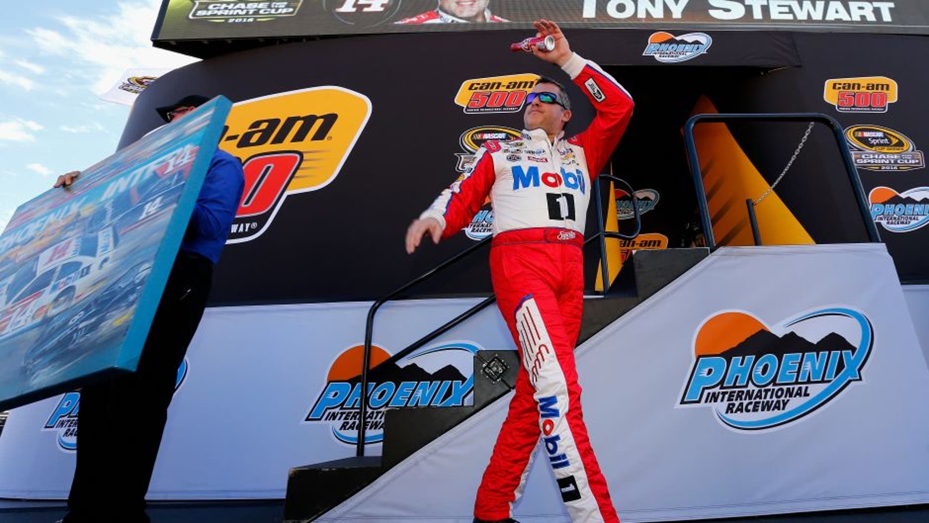 AVONDALE, AZ - NOVEMBER 13: Tony Stewart, driver of the #14 Mobil 1 Chevrolet, walks on stage during driver introductions prior to the NASCAR Sprint Cup Series Can-Am 500 at Phoenix International Raceway on November 13, 2016 in Avondale, Arizona. (Photo by Jonathan Ferrey/Getty Images)