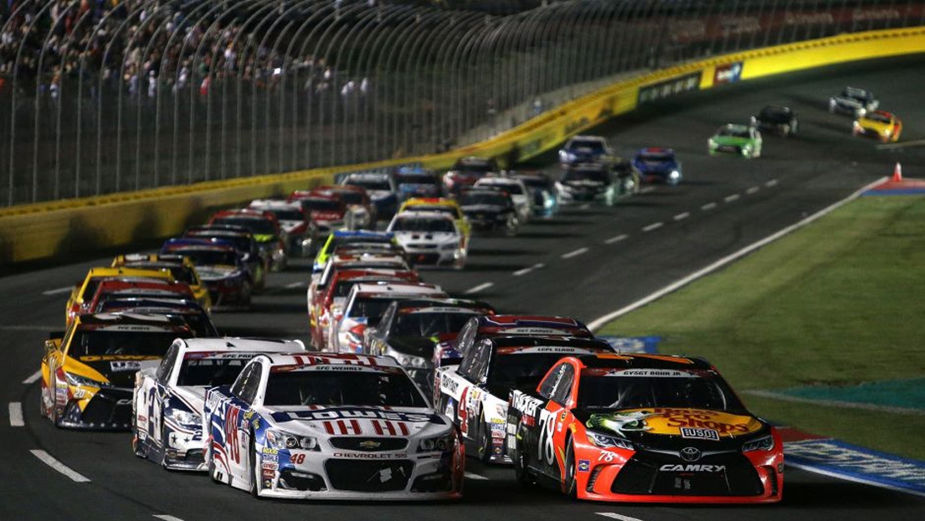 CHARLOTTE, NC - MAY 29: Martin Truex Jr., driver of the #78 Bass Pro Shops/Tracker Toyota, and Jimmie Johnson, driver of the #48 Lowe's Patriotic Chevrolet, lead a restart during the NASCAR Sprint Cup Series Coca-Cola 600 at Charlotte Motor Speedway on May 29, 2016 in Charlotte, North Carolina. (Photo by Jerry Markland/NASCAR via Getty Images)