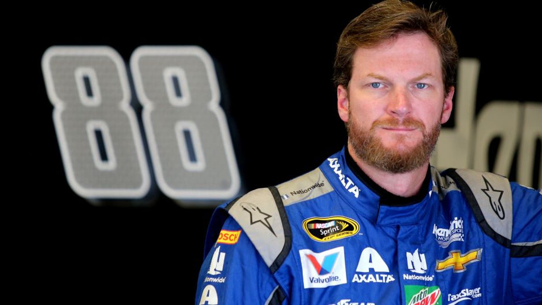 DAYTONA BEACH, FL - JUNE 30: Dale Earnhardt Jr., driver of the #88 Nationwide Chevrolet, stands in the garage area during practice for the NASCAR Sprint Cup Series Coke Zero 400 at Daytona International Speedway on June 30, 2016 in Daytona Beach, Florida. (Photo by Jerry Markland/Getty Images)