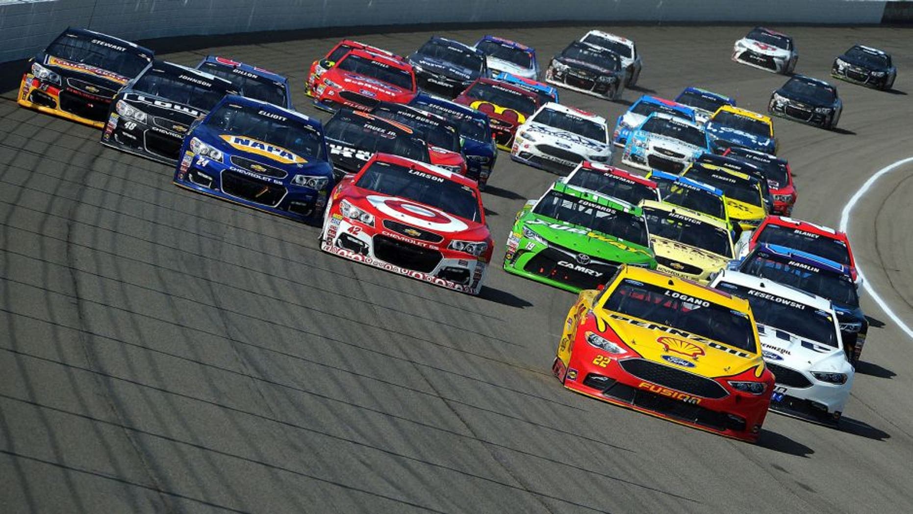 BROOKLYN, MI - JUNE 12: Joey Logano, driver of the #22 Shell Pennzoil Ford, leads the field during the NASCAR Sprint Cup Series FireKeepers Casino 400 at Michigan International Speedway on June 12, 2016 in Brooklyn, Michigan. (Photo by Drew Hallowell/Getty Images )