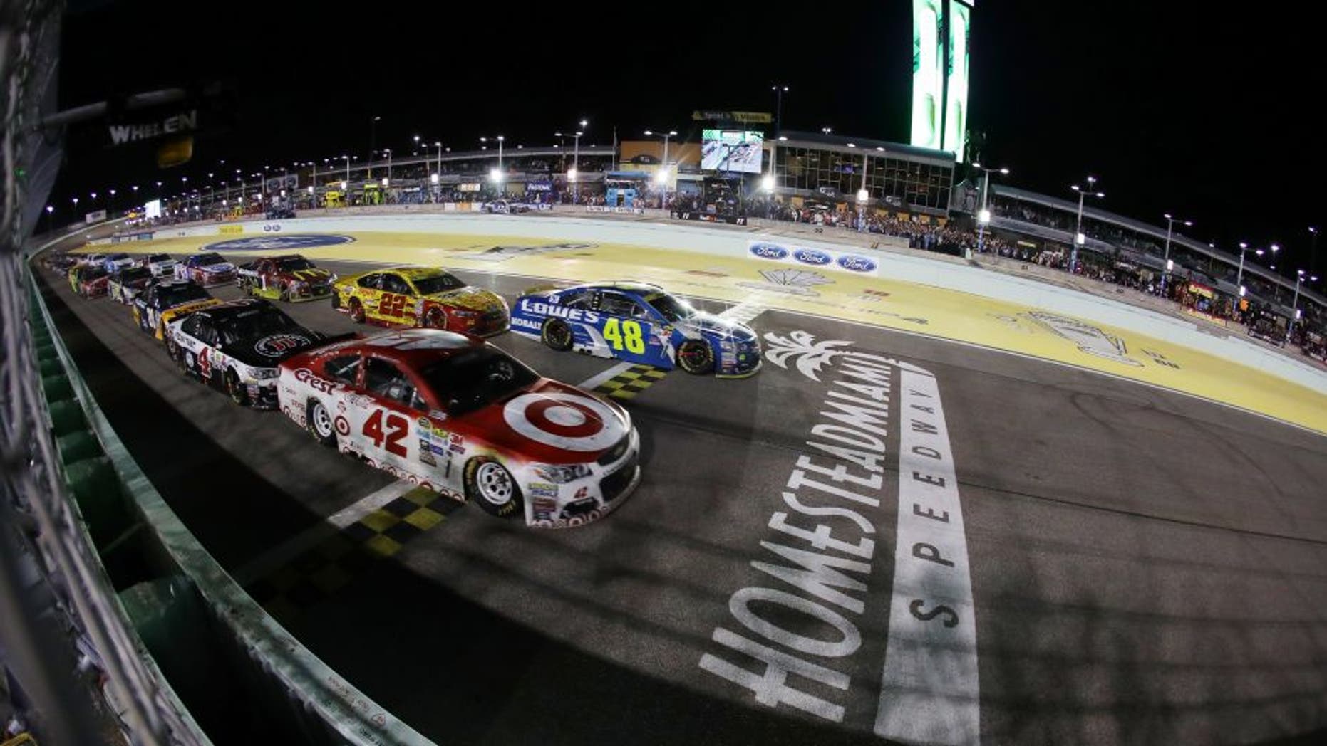 HOMESTEAD, FL - NOVEMBER 20: Kyle Larson, driver of the #42 Target Chevrolet, and Jimmie Johnson, driver of the #48 Lowe's Chevrolet, lead the field on the final restart during the NASCAR Sprint Cup Series Ford EcoBoost 400 at Homestead-Miami Speedway on November 20, 2016 in Homestead, Florida. (Photo by Sarah Crabill/Getty Images)