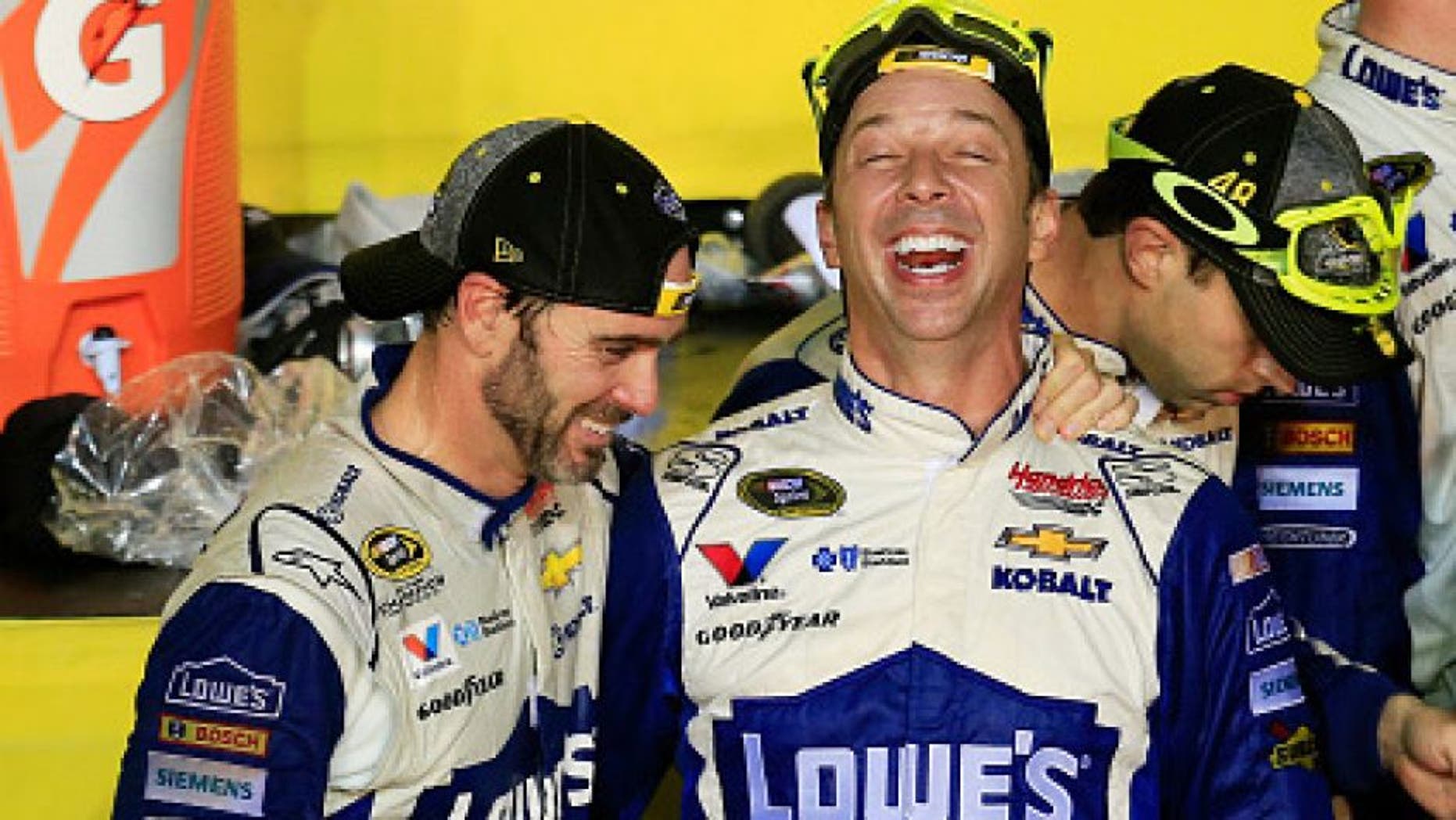HOMESTEAD, FL - NOVEMBER 20: Jimmie Johnson (L), driver of the #48 Lowe's Chevrolet, celebrates with crew chief Chad Knaus in Victory Lane after winning the NASCAR Sprint Cup Series Ford EcoBoost 400 and the 2016 NASCAR Sprint Cup Series Championship at Homestead-Miami Speedway on November 20, 2016 in Homestead, Florida. Johnson wins a record-tying 7th NASCAR title. (Photo by Chris Trotman/Getty Images)