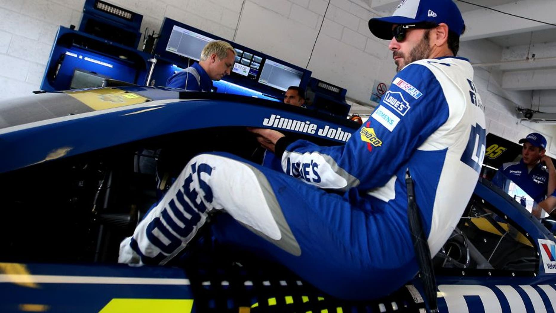 HOMESTEAD, FL - NOVEMBER 19: Jimmie Johnson, driver of the #48 Lowe's Chevrolet, climbs into his car during practice for the NASCAR Sprint Cup Series Ford EcoBoost 400 at Homestead-Miami Speedway on November 19, 2016 in Homestead, Florida. (Photo by Sean Gardner/NASCAR via Getty Images)
