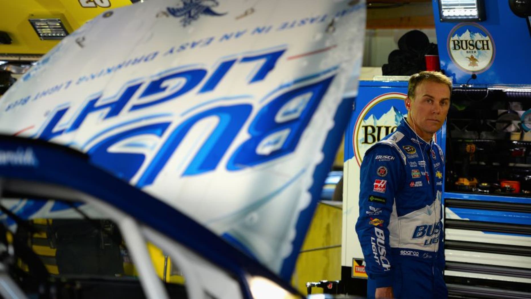 MARTINSVILLE, VA - OCTOBER 29: Kevin Harvick, driver of the #4 Busch Light Chevrolet, stands in the garage area during practice for the NASCAR Sprint Cup Series Goody's Fast Relief 500 at Martinsville Speedway on October 29, 2016 in Martinsville, Virginia. (Photo by Robert Laberge/Getty Images)