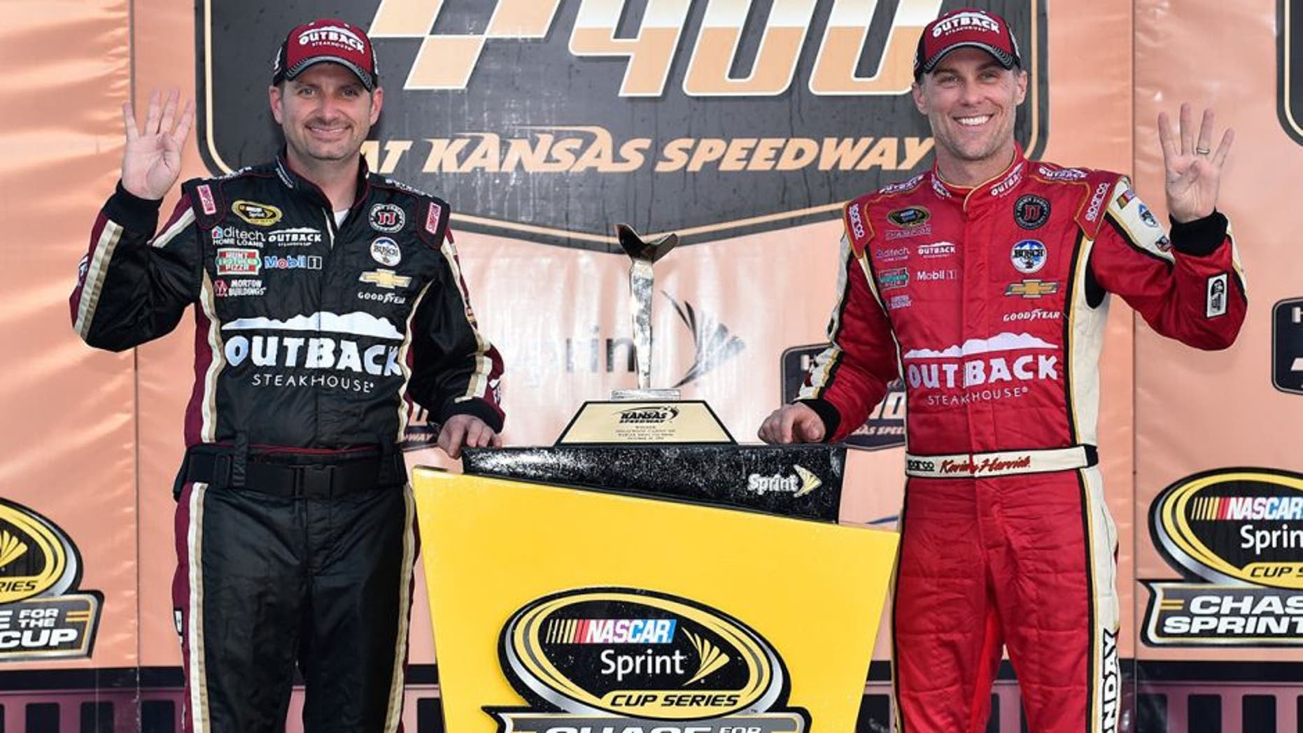 KANSAS CITY, KS - OCTOBER 16: Kevin Harvick, driver of the #4 Outback Chevrolet, and crew chief Rodney Childers pose with the trophy after winning the NASCAR Sprint Cup Series Hollywood Casino 400 at Kansas Speedway on October 16, 2016 in Kansas City, Kansas. (Photo by Jason Hanna/Getty Images)