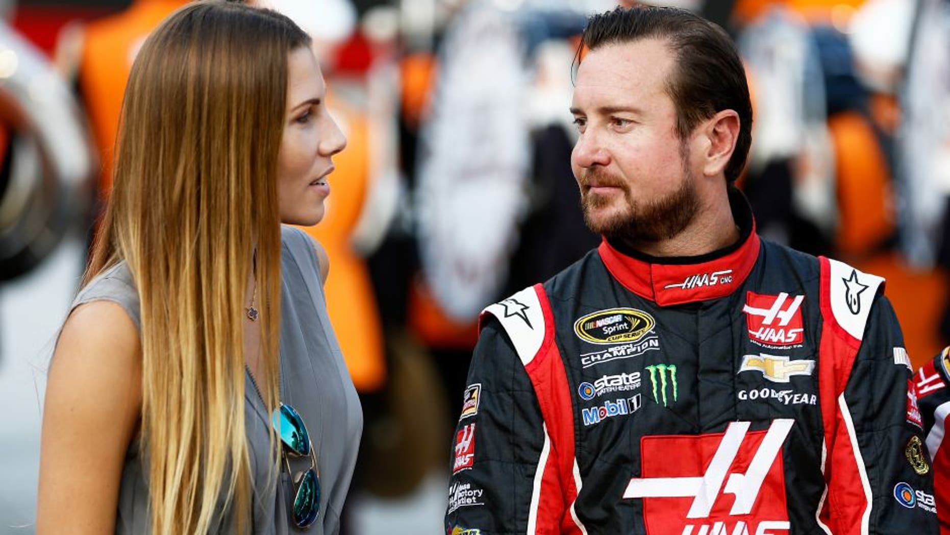 BRISTOL, TN - AUGUST 22: Kurt Busch, driver of the #41 Haas Automation Chevrolet, talks to his girlfriend, Ashley Van Metre, prior to the NASCAR Sprint Cup Series IRWIN Tools Night Race at Bristol Motor Speedway on August 22, 2015 in Bristol, Tennessee. (Photo by Jeff Zelevansky/Getty Images)