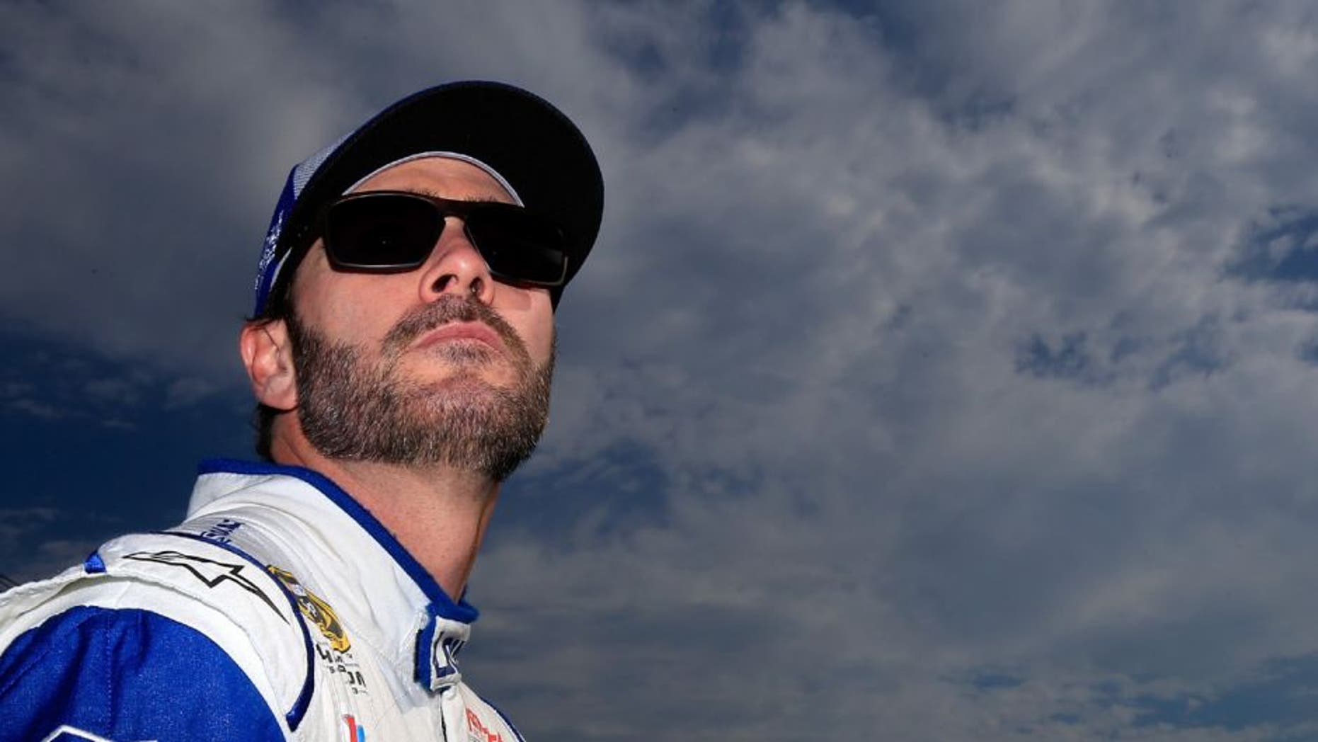 LOUDON, NH - JULY 15: Jimmie Johnson, driver of the #48 Lowe's Chevrolet, stands on the grid during qualifying for the NASCAR Sprint Cup Series New Hampshire 301 at New Hampshire Motor Speedway on July 16, 2016 in Loudon, New Hampshire. (Photo by Chris Trotman/Getty Images)