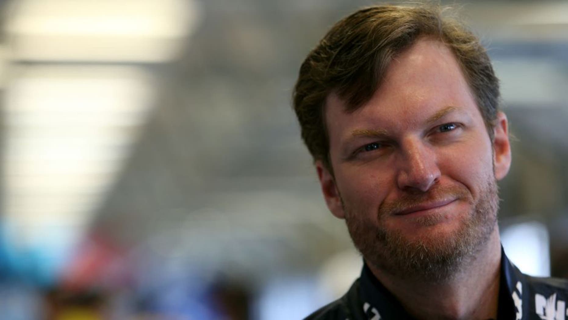 SPARTA, KY - JULY 08: Dale Earnhardt Jr., driver of the #88 Nationwide Chevrolet, stands in the garage area during practice for the NASCAR Sprint Cup Series Quaker State 400 at Kentucky Speedway on July 8, 2016 in Sparta, Kentucky. (Photo by Matt Hazlett/Getty Images)