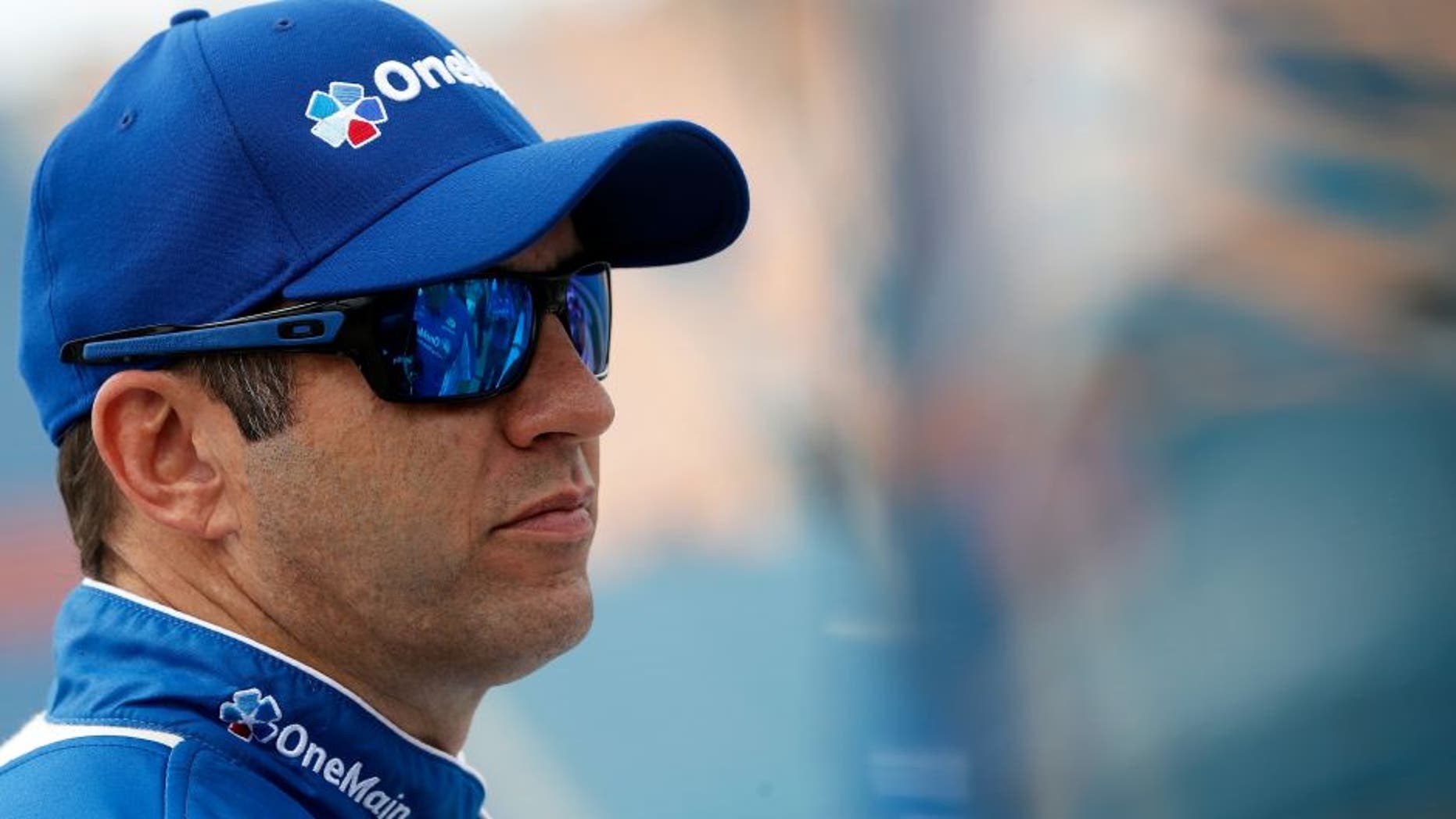 JOLIET, IL - SEPTEMBER 17: Elliott Sadler, driver of the #1 OneMain Chevrolet, stands on the grid during qualifying for the NASCAR XFINITY Series Drive for Safety 300 at Chicagoland Speedway on September 17, 2016 in Joliet, Illinois. (Photo by Brian Lawdermilk/NASCAR via Getty Images)