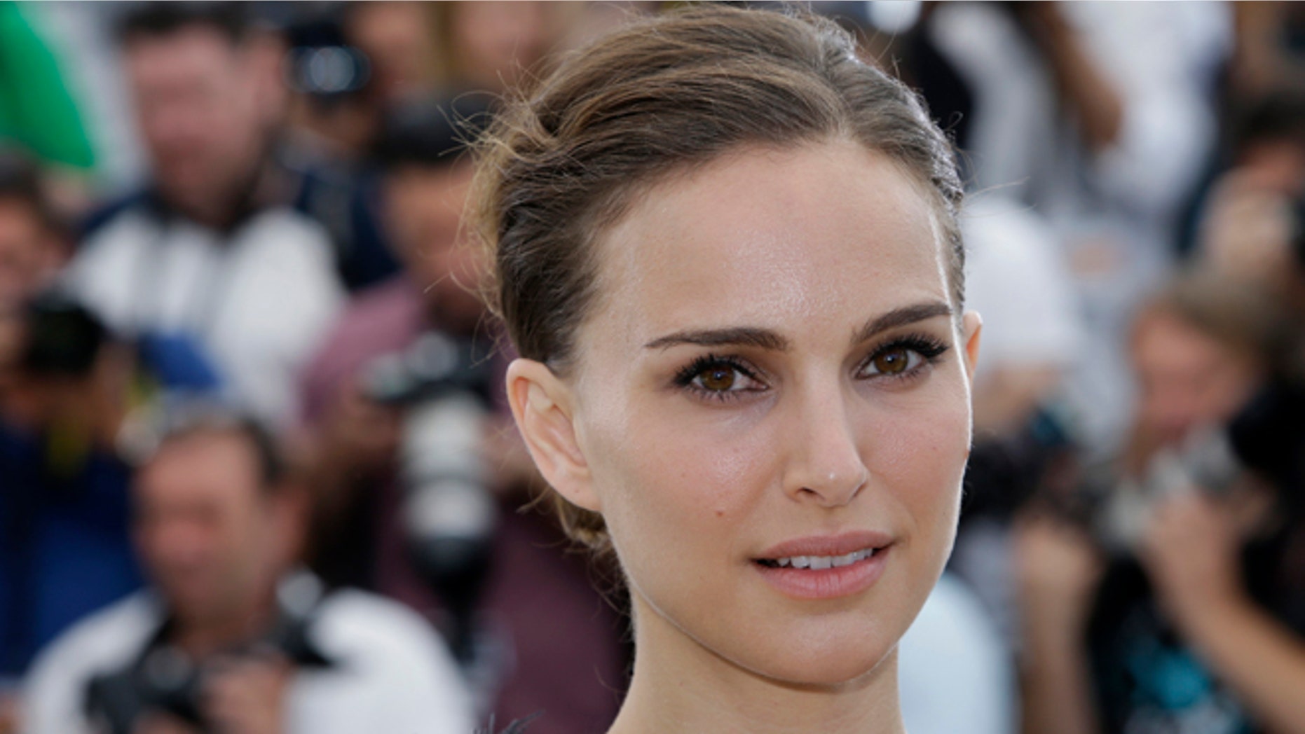 May 17, 2015 file photo, Natalie Portman poses for photographers during a photo call for the film "A Tale of Love and Darkness," at the 68th international film festival, Cannes, southern France.