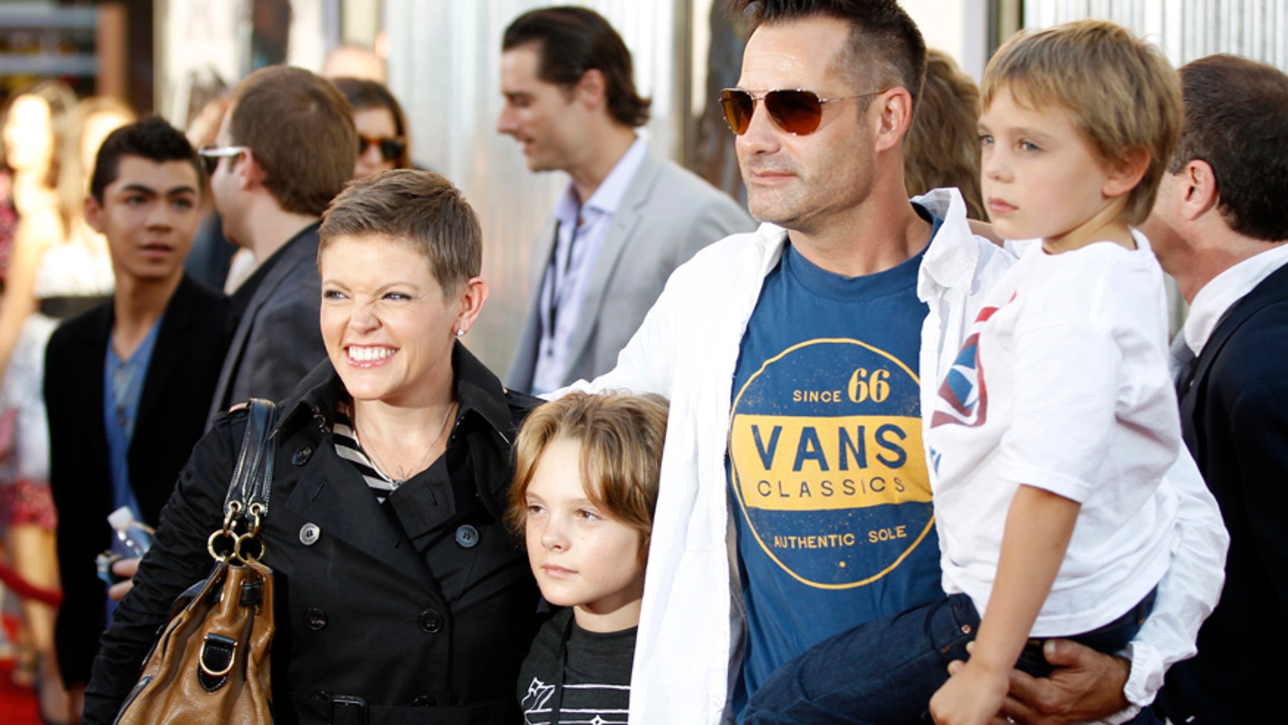 Natalie Maines (L), lead singer for the band "Dixie Chicks", her husband actor Adrian Pasdar (2nd R), and their sons Jackson (2nd L) and Beckett (R) pose at the premiere of "Real Steel" in Los Angeles October 2, 2011.