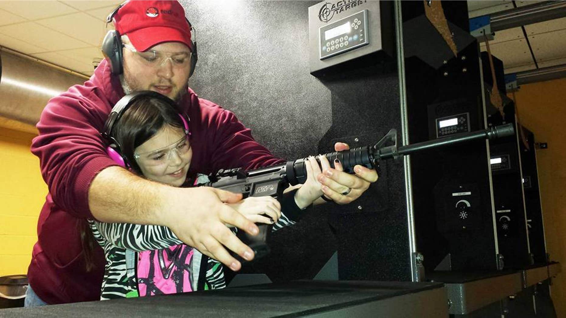 Natalie Gibson practices her shot with father Nathan.