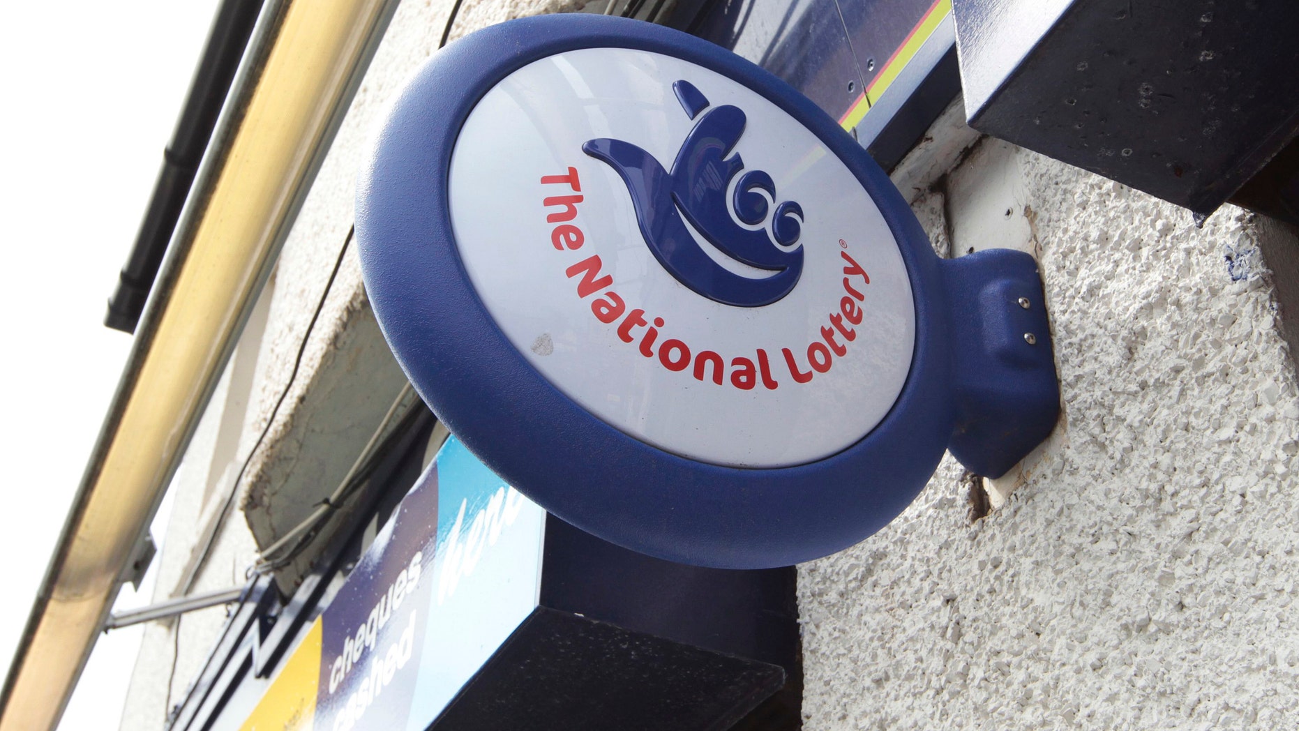 File photo - A National Lottery sign is seen over the entrance of a newsagents (REUTERS/David Moir).