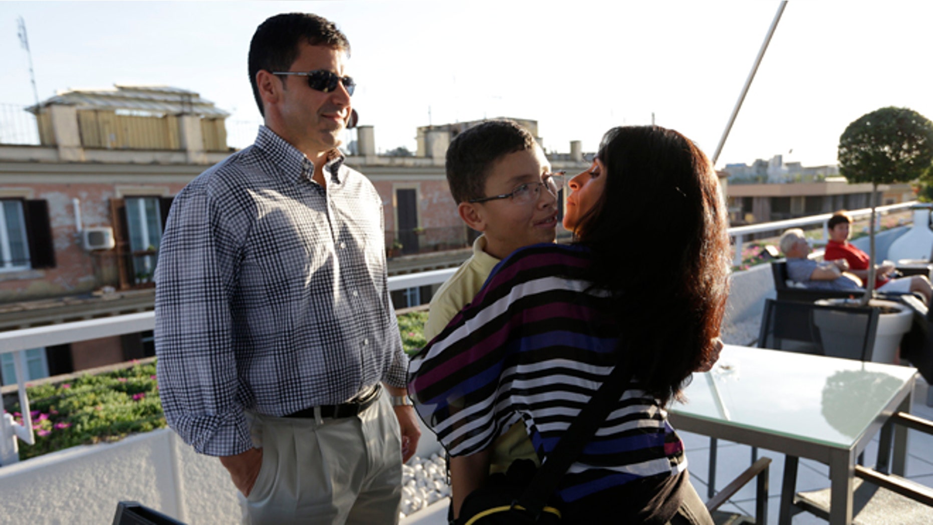 Oct. 18, 2012: Jake Finkbonner, of Ferndale, Washington, center, is hugged by his mother Elsa, as his father Donny looks at them, in Rome.