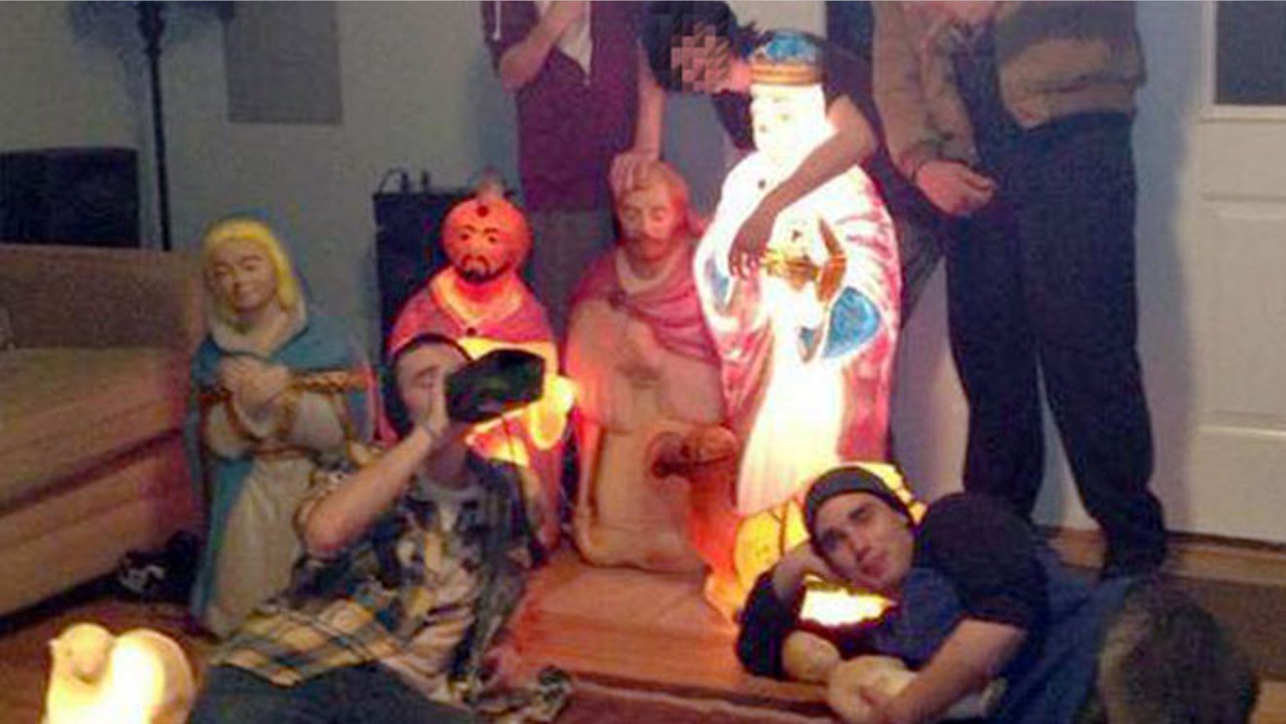 This undated photo shows the nativity scene and the teens charged with stealing it.
