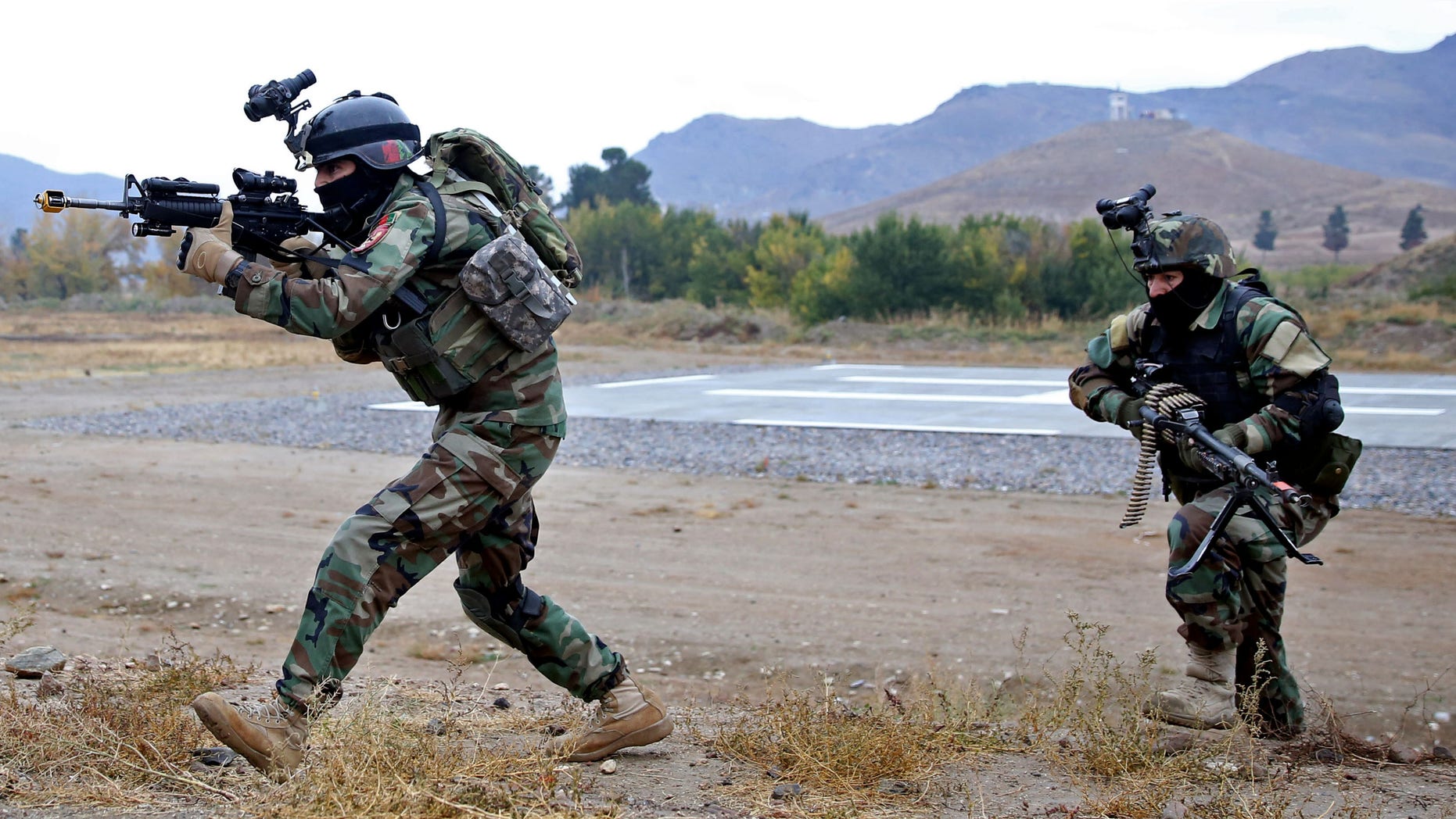 Nov. 6, 2014: Afghan special forces demonstrate their skills during the Secretary General of NATO, Jens Stoltenberg's first visit as head of NATO at the special forces training camp