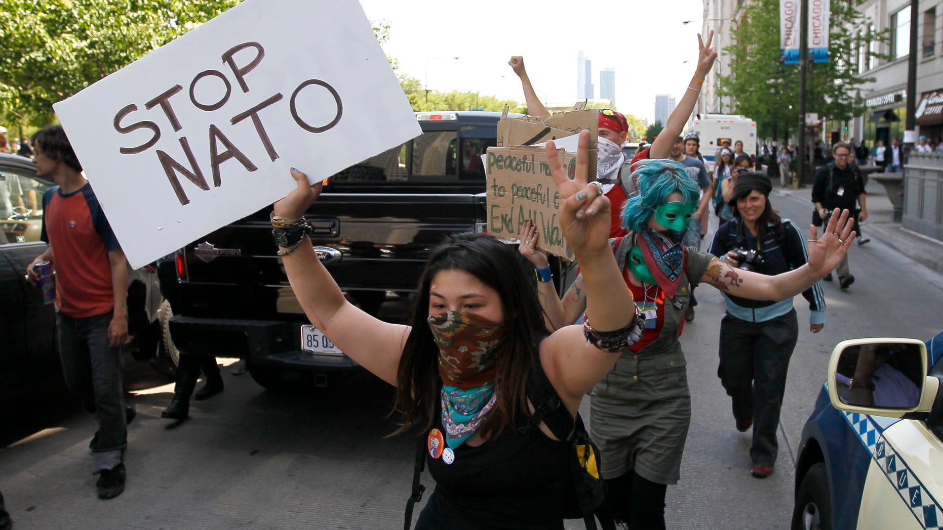 May 18, 2012: Protesters block traffic on Michigan Ave., as they march through the city during a demonstration, ahead of this weekends' NATO summit in Chicago.