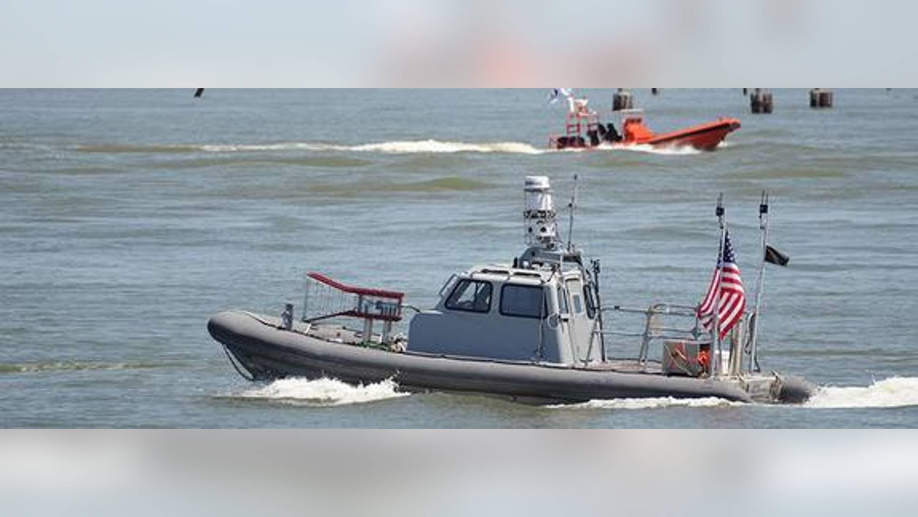 During a recent Navy exercise, unmanned boats, such as this rigid hulled inflatable boat, swarmed a simulated enemy without humans controlling them.