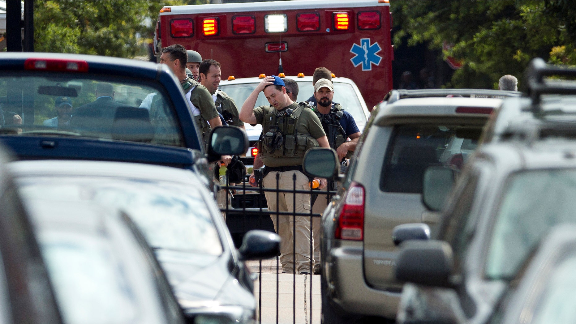 September 16, 2013: Heavily armed U.S. marshals walk from the Washington Navy Yard after a shooting by gunman Aaron Alexis.