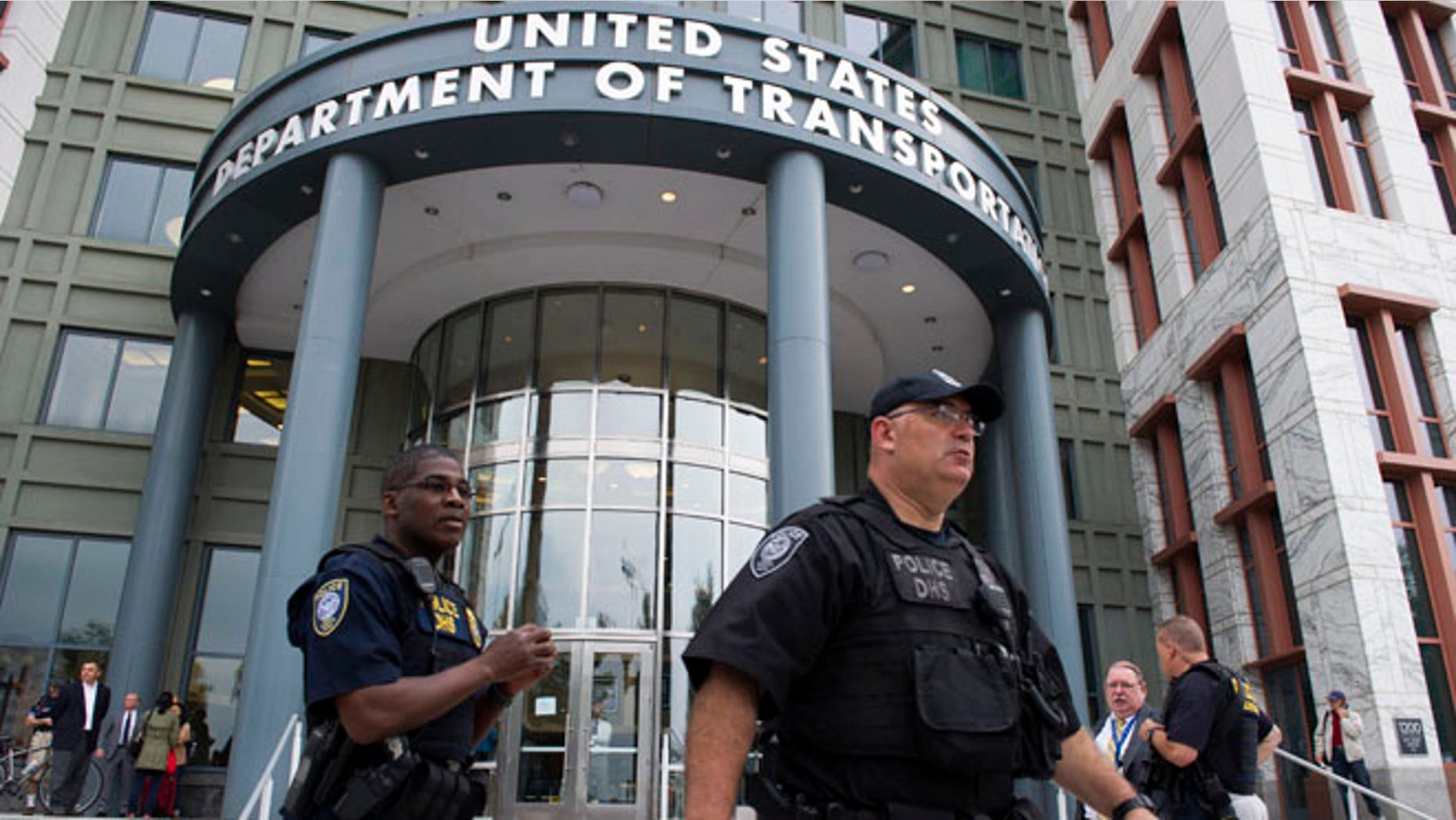 July 2, 2015: Police outside the Transportation Department, inside the Washington Navy Yard, after reports of shots fired. Washington, D.C.