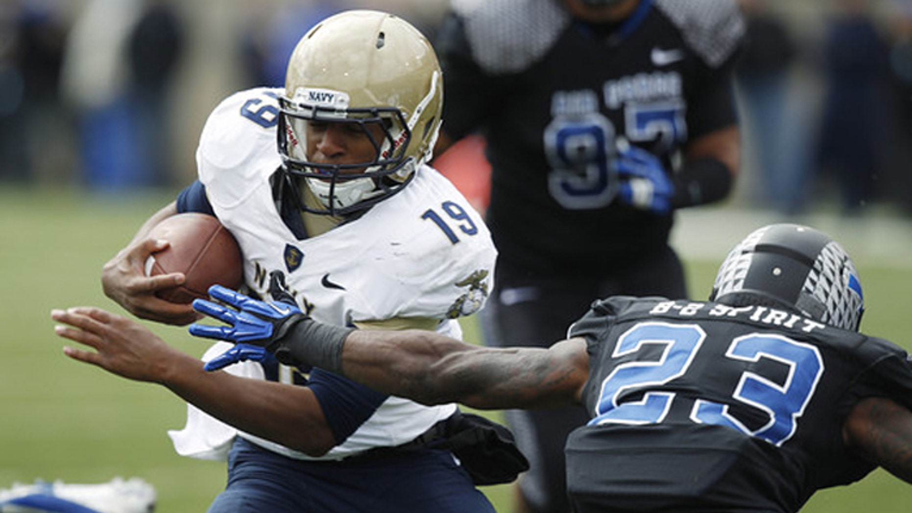 Navy quarterback Keenan Reynolds, left, runs for a touchdown past Air Force defensive back Steffon Batts in the fourth quarter of Navy’s 28-21 overtime victory last October. (AP)