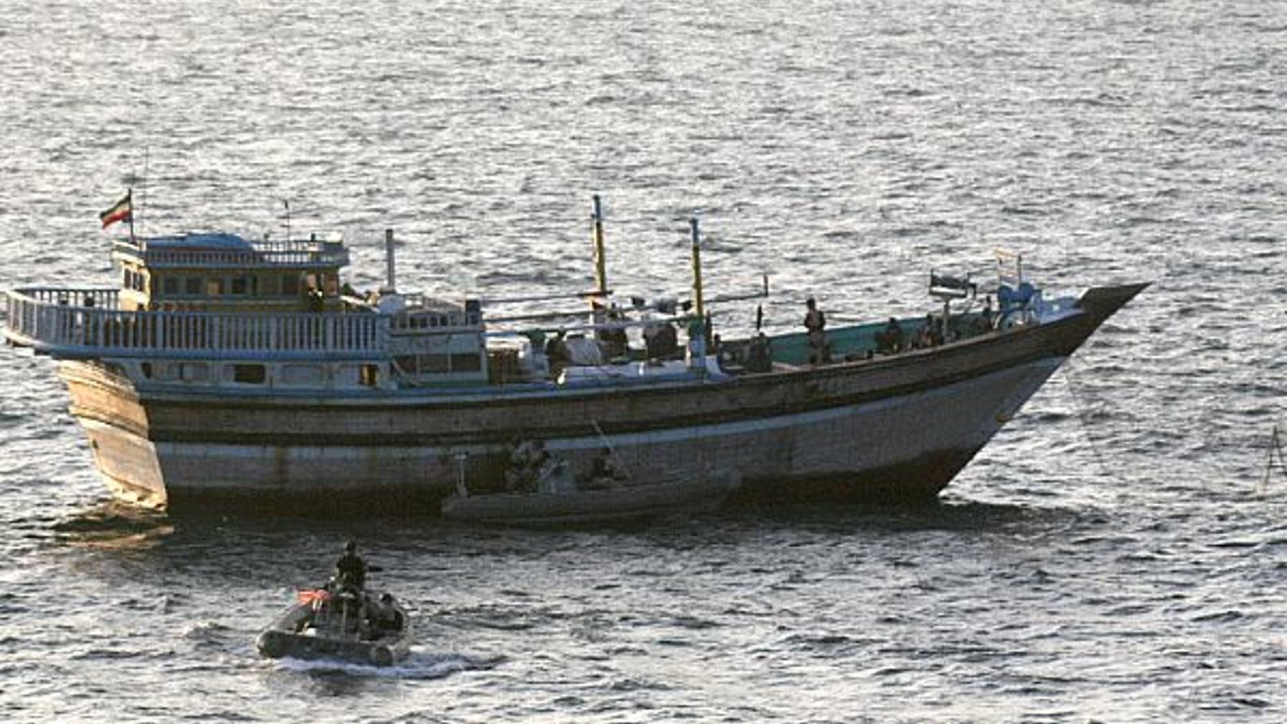 Jan. 5, 2012: A Sailor aboard a safety boat observes a visit, board, search and seizure team, assigned to the guided-missile destroyer USS Kidd (DDG 100), board the Iranian-flagged fishing dhow Al Molai.
