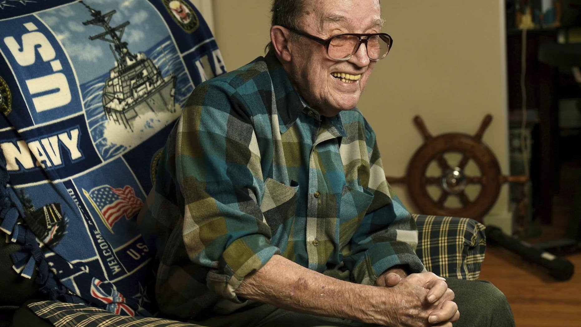 Retired Master Chief Lawrence J. Reilly Sr., a U.S. Navy veteran of World War II and the Vietnam War, who survived the 1969 ship collision that claimed the life of his son, and later fought unsuccessfully to have the victims' names inscribed on the Vietnam Veterans Memorial has died. He was 93. (Mike Greenlar /The Syracuse Newspapers via AP, File)